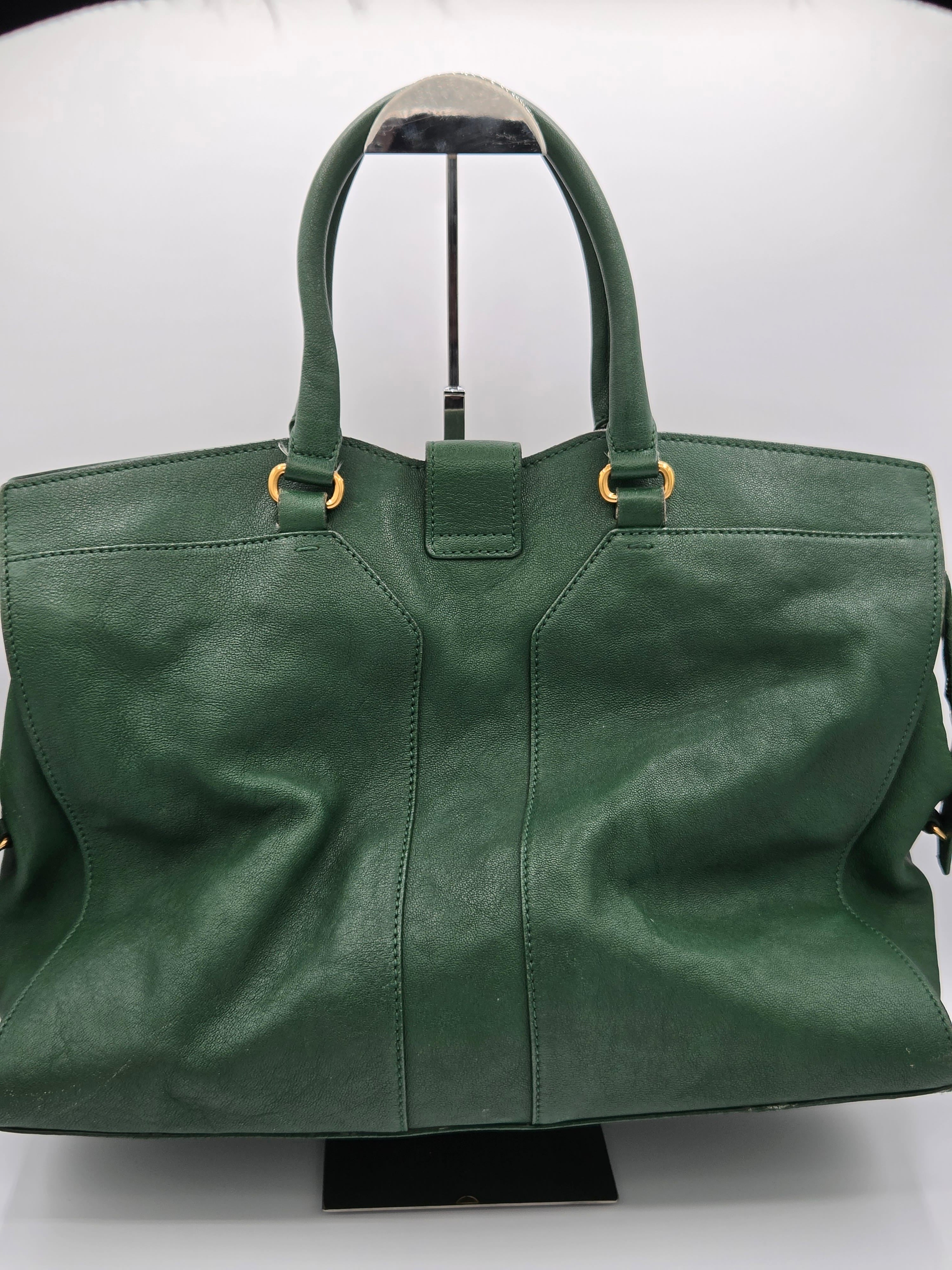 Green leather bag on a white background