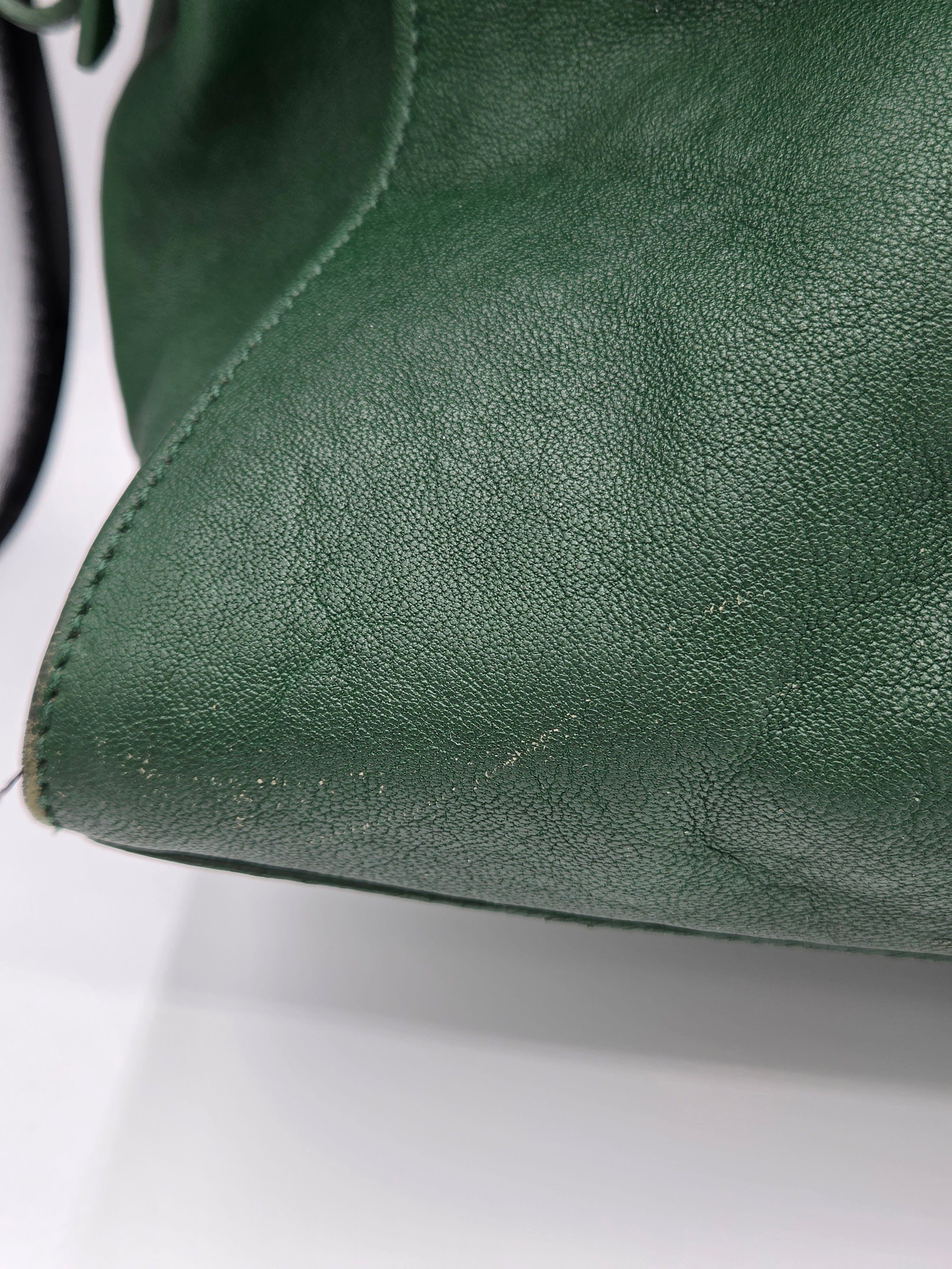 Close-up of green leather surface with visible texture