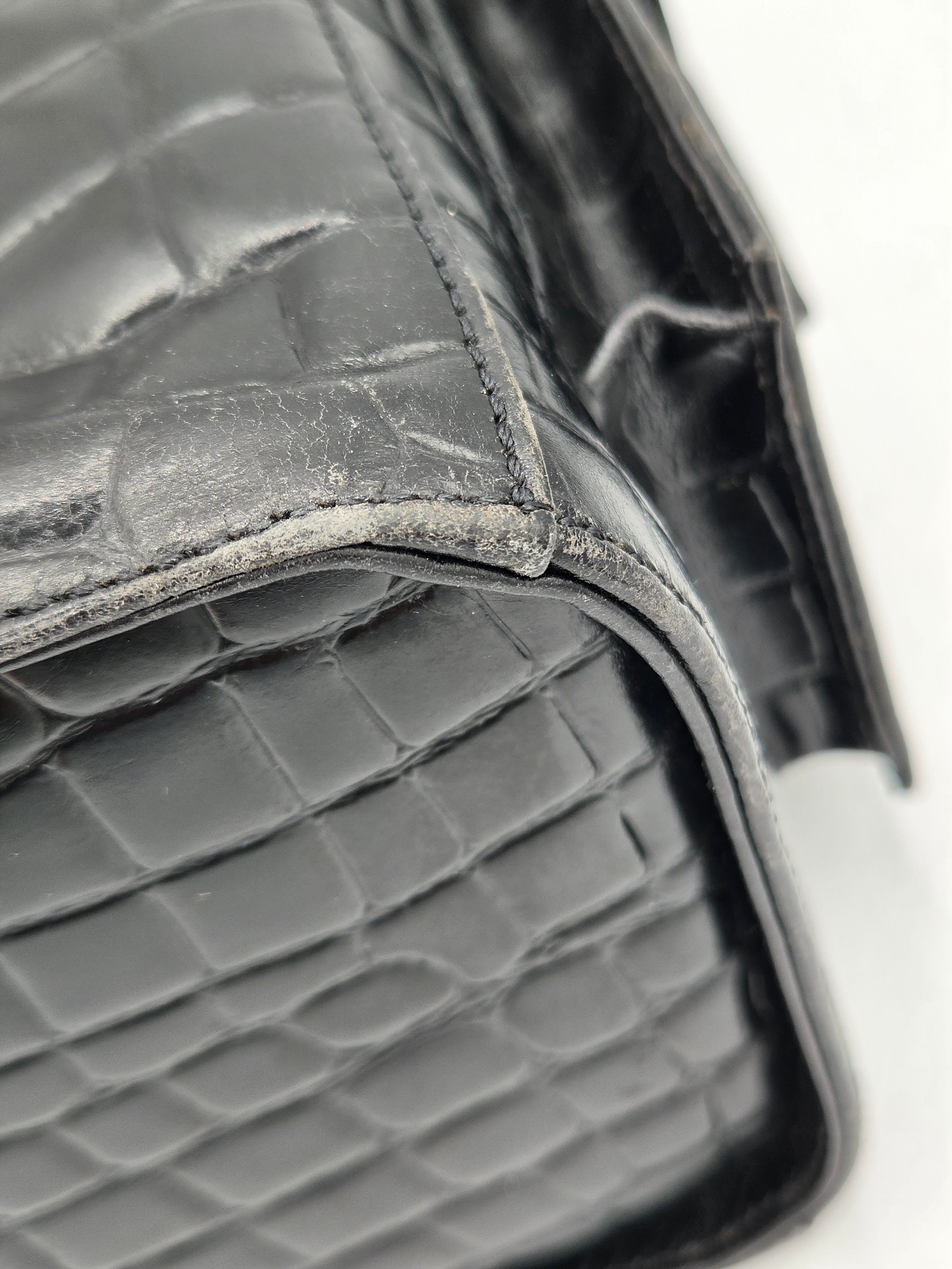 Close-up of a textured car seat cover with a diamond pattern.