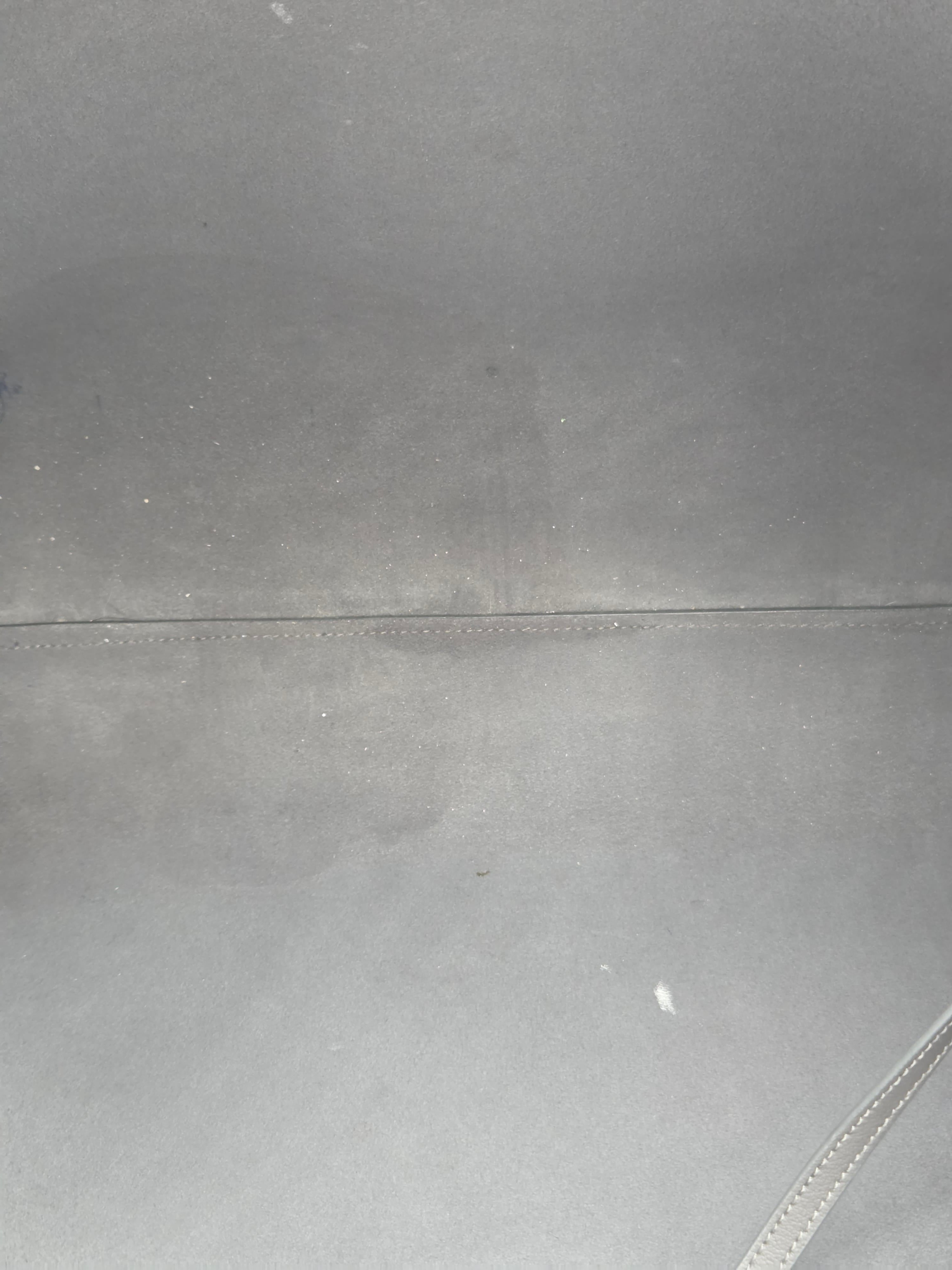 Close-up of a gray fabric surface with a seam