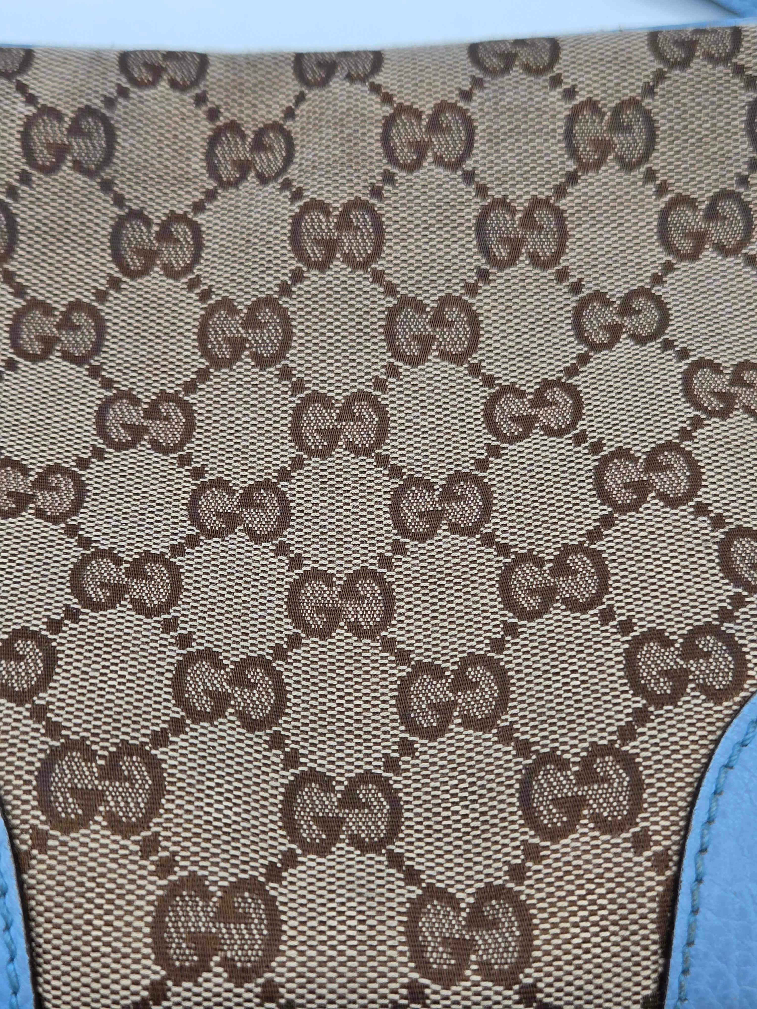 Close-up of a patterned fabric with brown and beige design on a blue background