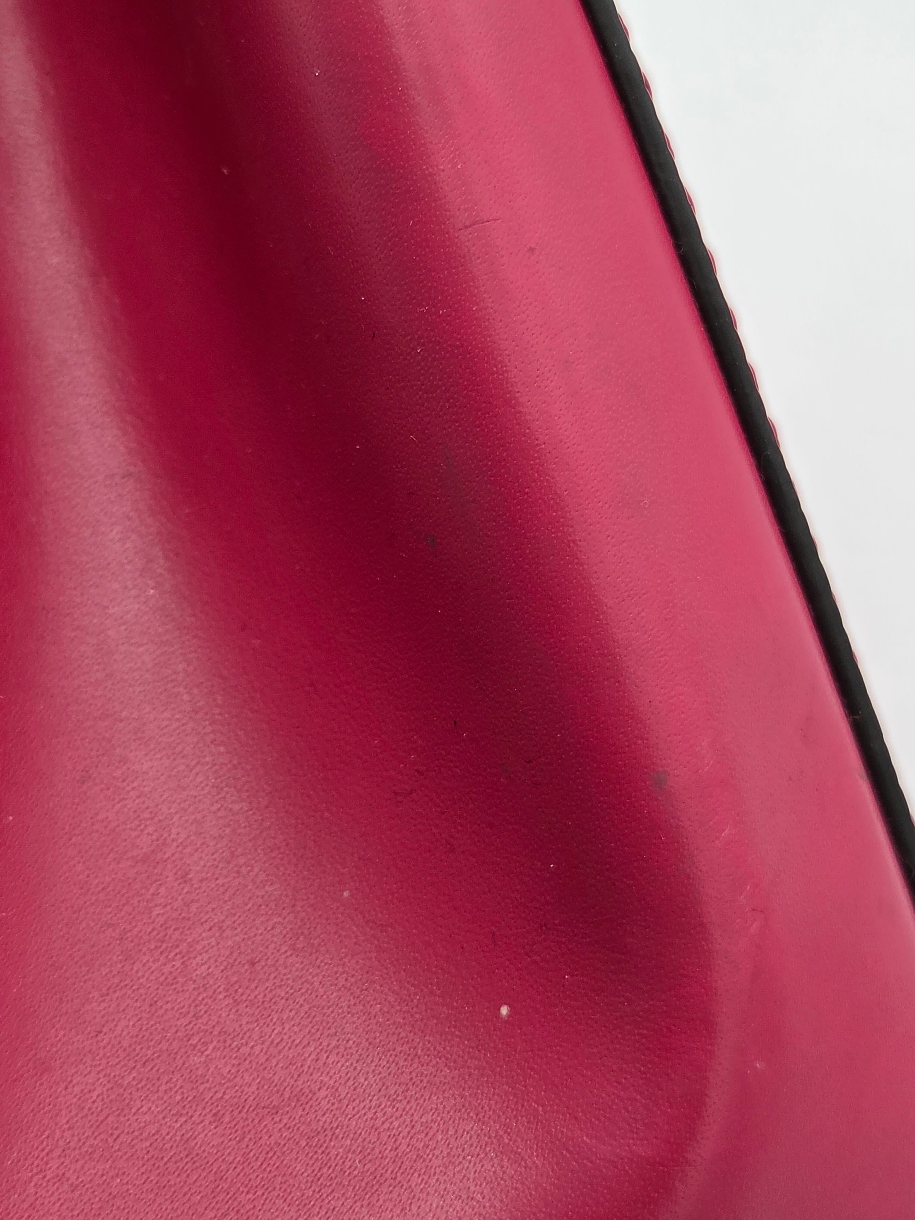 Close-up of a red surface with a black border