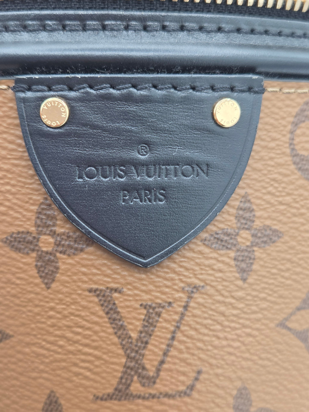 Close-up of a Louis Vuitton wallet with monogram pattern