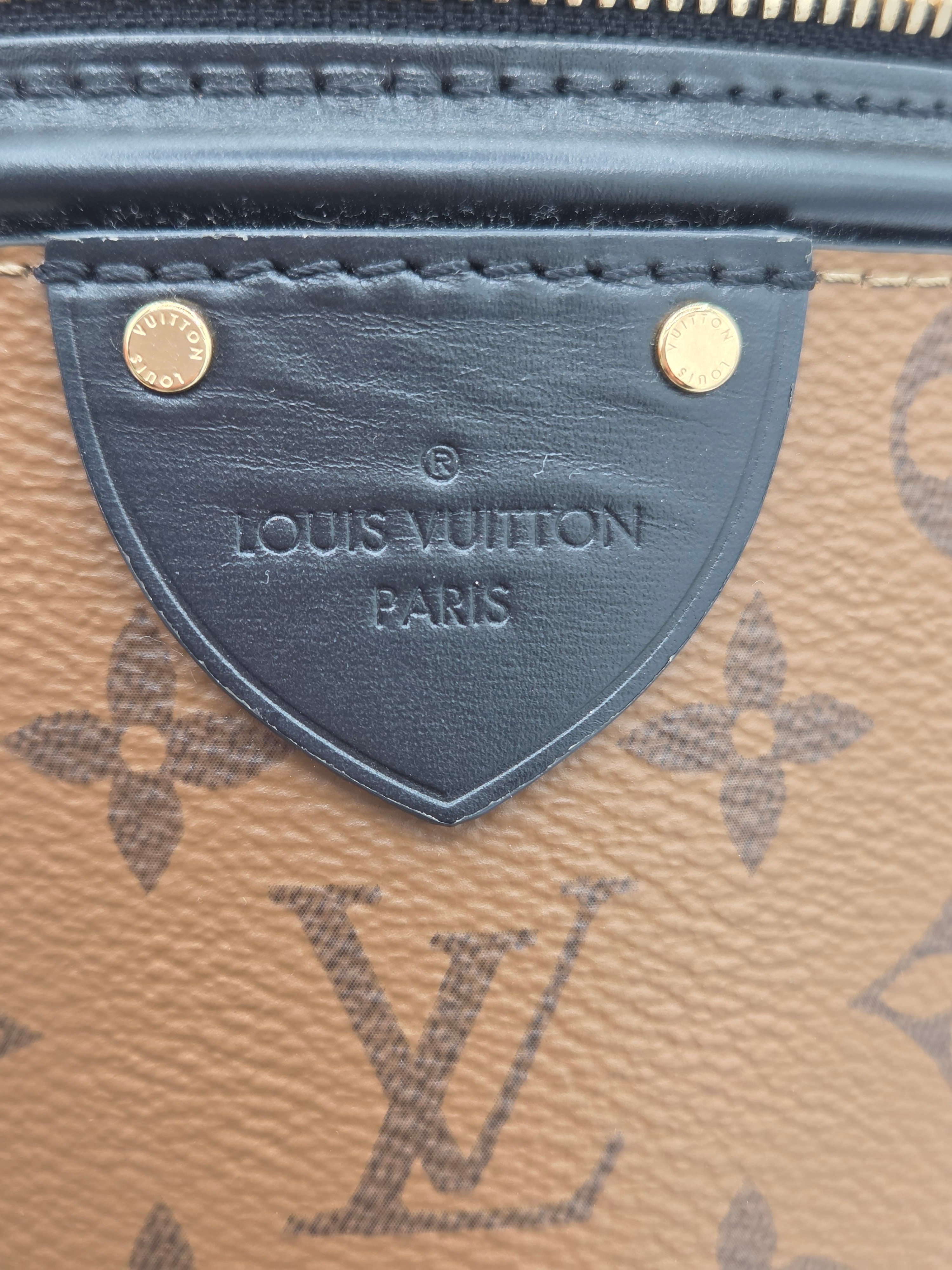Close-up of a Louis Vuitton wallet with monogram pattern