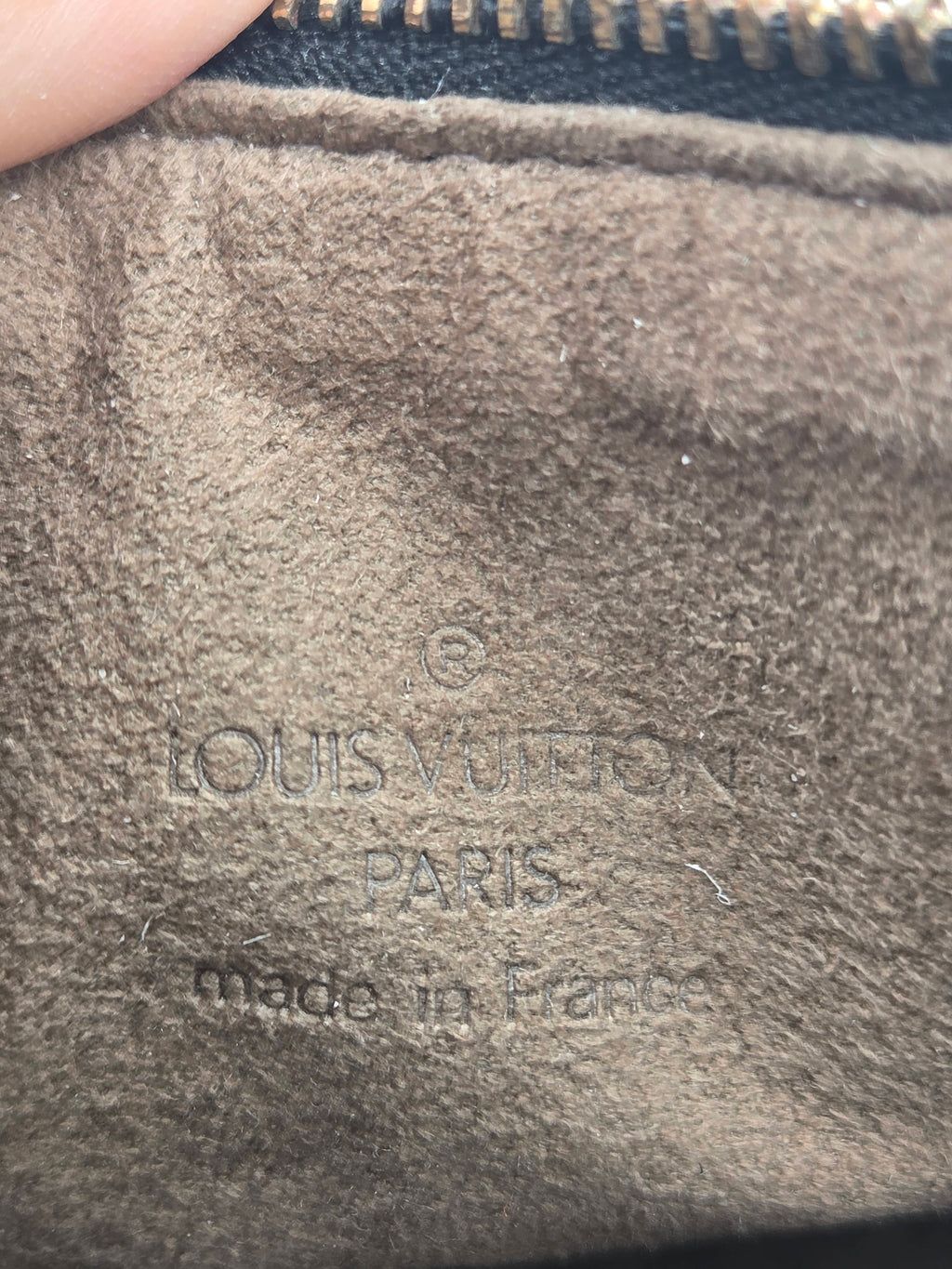 close up of stamp inside handbag