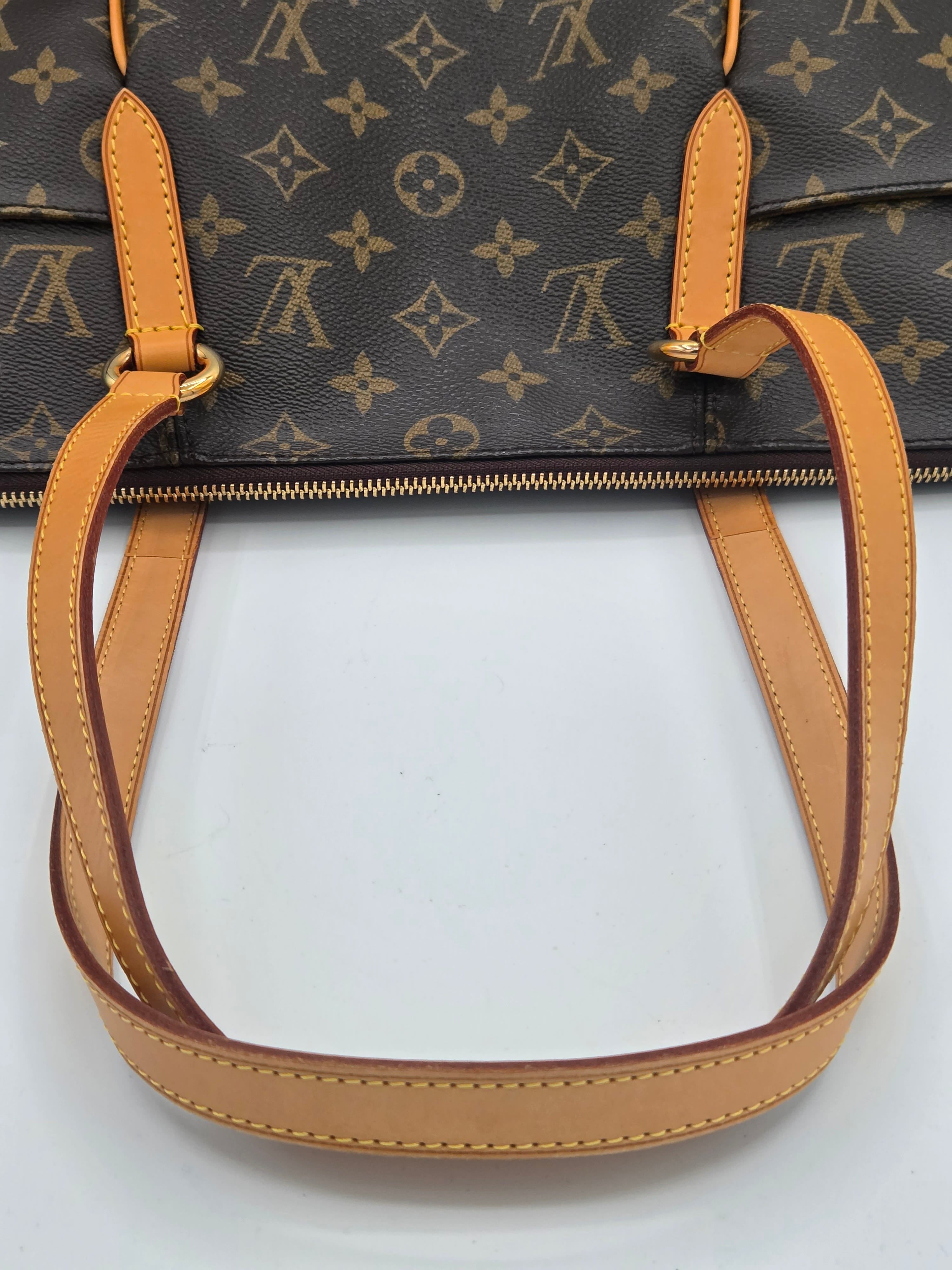 Close-up of a Louis Vuitton handbag in dark brown monogram canvas with tan leather handles and trim, shown against a plain white background.