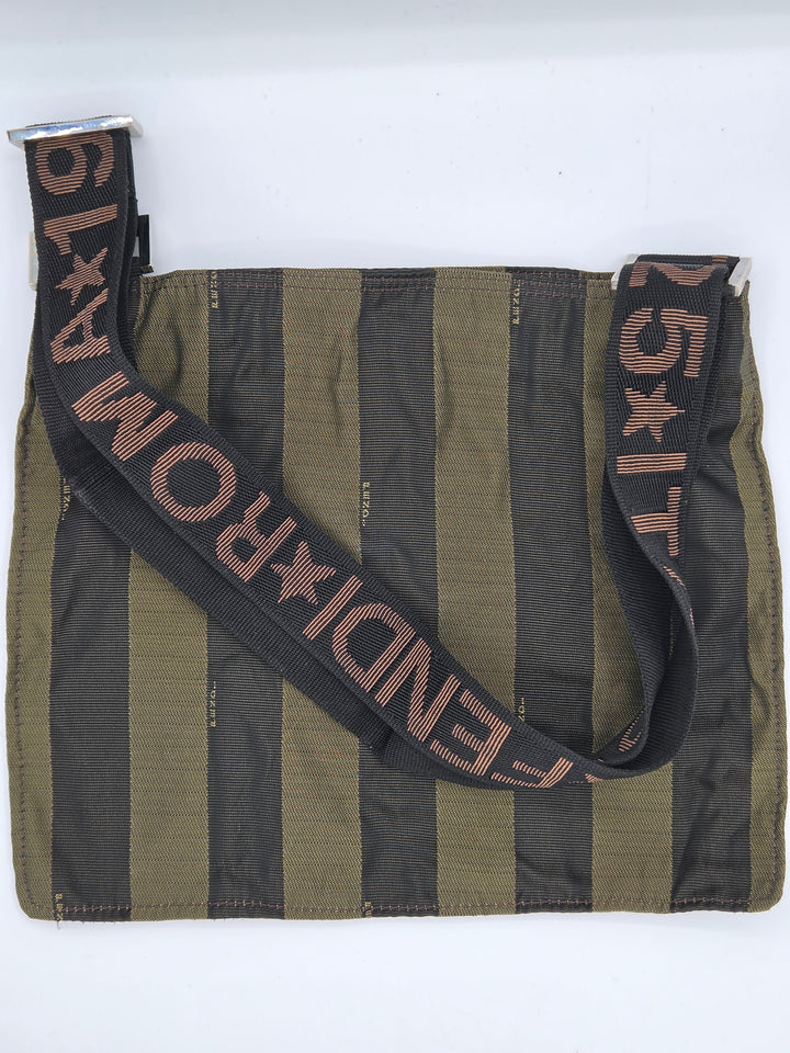 A Fendi shoulder bag with vertical olive green and black stripes, featuring a wide black strap with 'FENDI ROMA' and star motifs in brown.