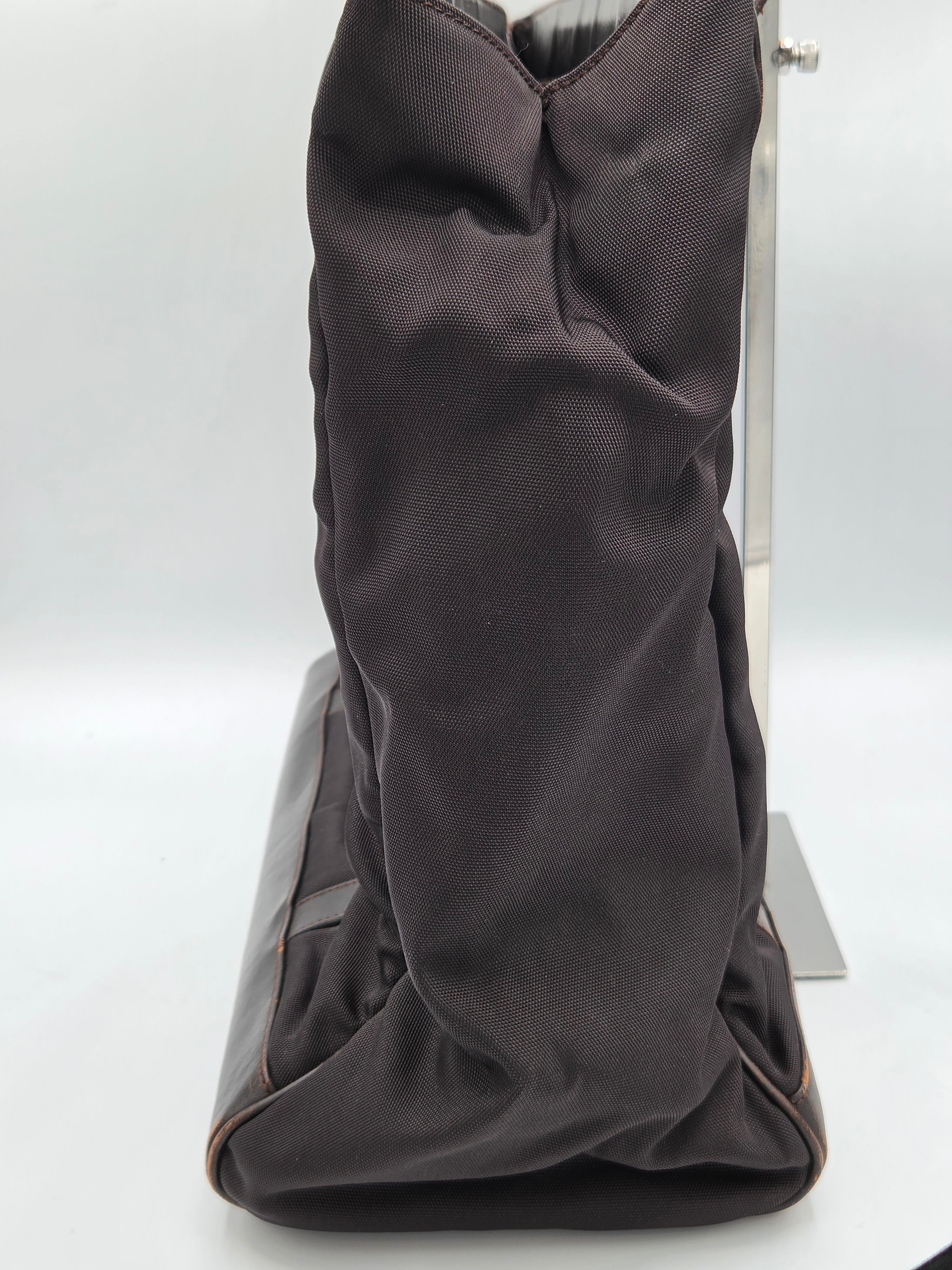 A dark brown fabric-covered boot or shoe shown from an angled side view against a plain white background.