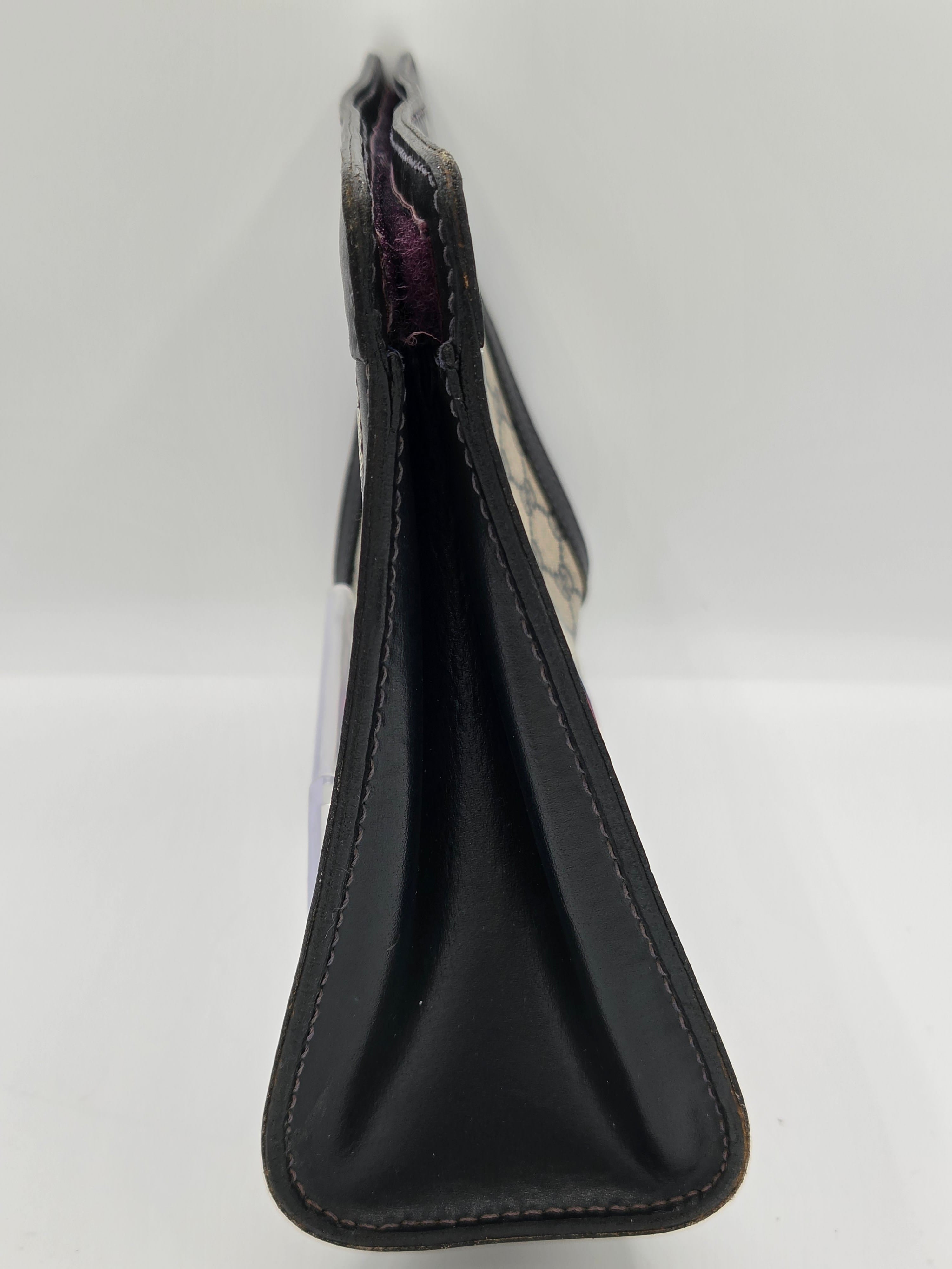 A black leather motorcycle handbrake lever cover with visible stitching, shown on a plain white background.