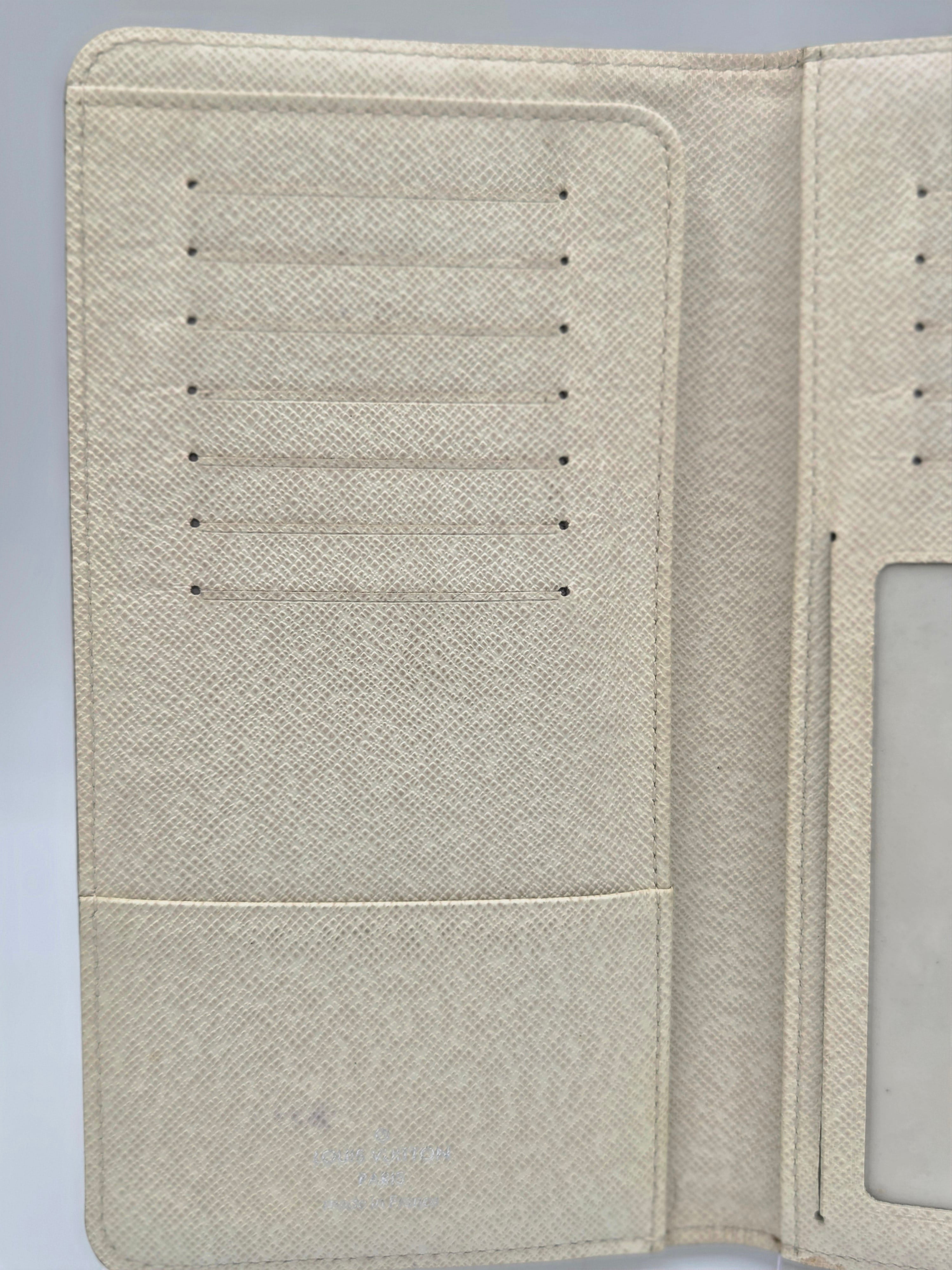 Beige textured faux-leather wallet cover shown open, displaying interior card slots on the left and an ID window on the right.