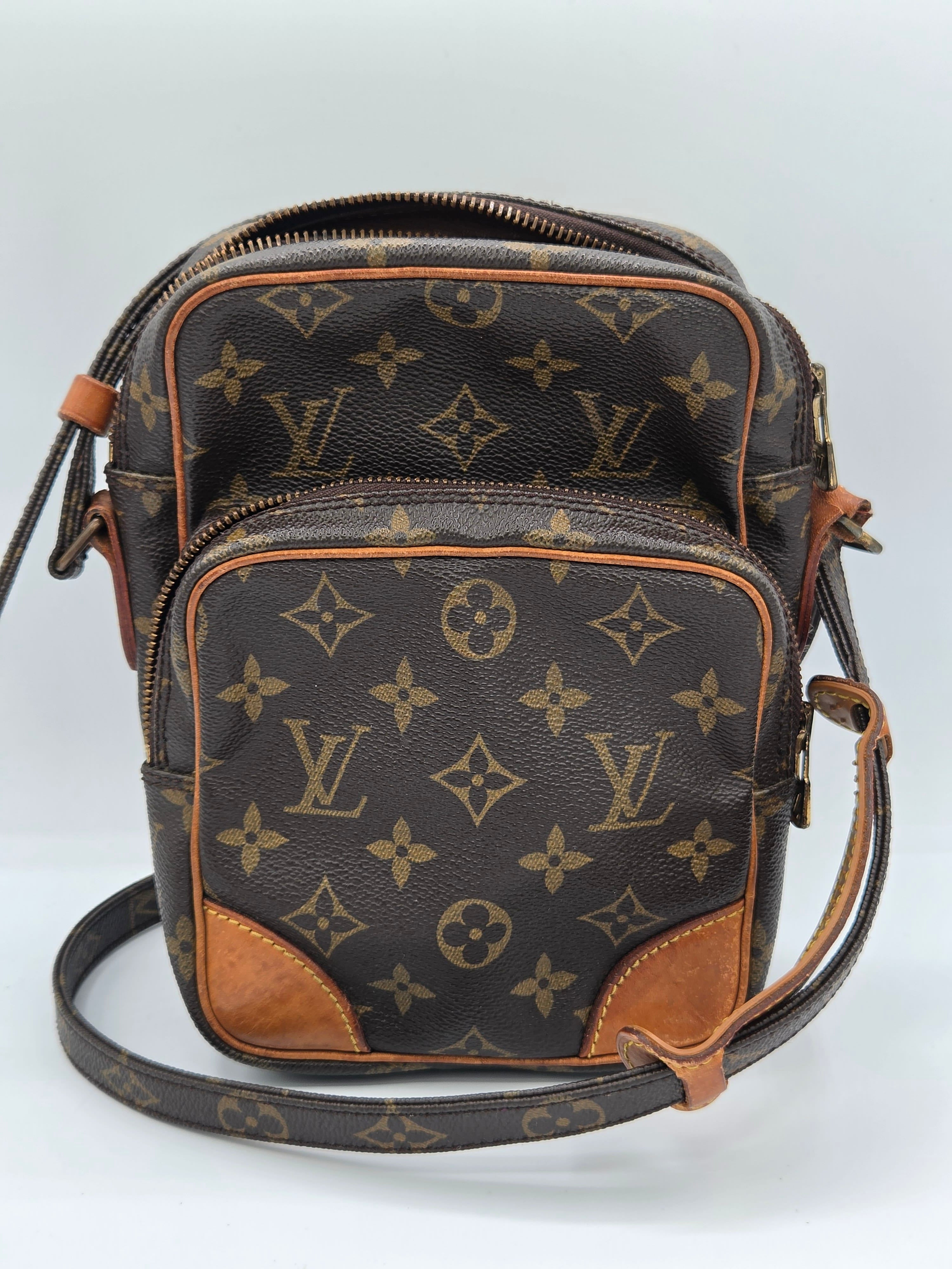 A Louis Vuitton monogram canvas shoulder bag in dark brown with tan leather trim and a matching monogram strap, shown against a plain white background.