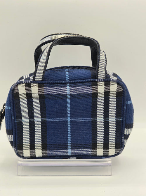 A small blue plaid lunch bag with a top handle, shown from a side angle against a plain light background.