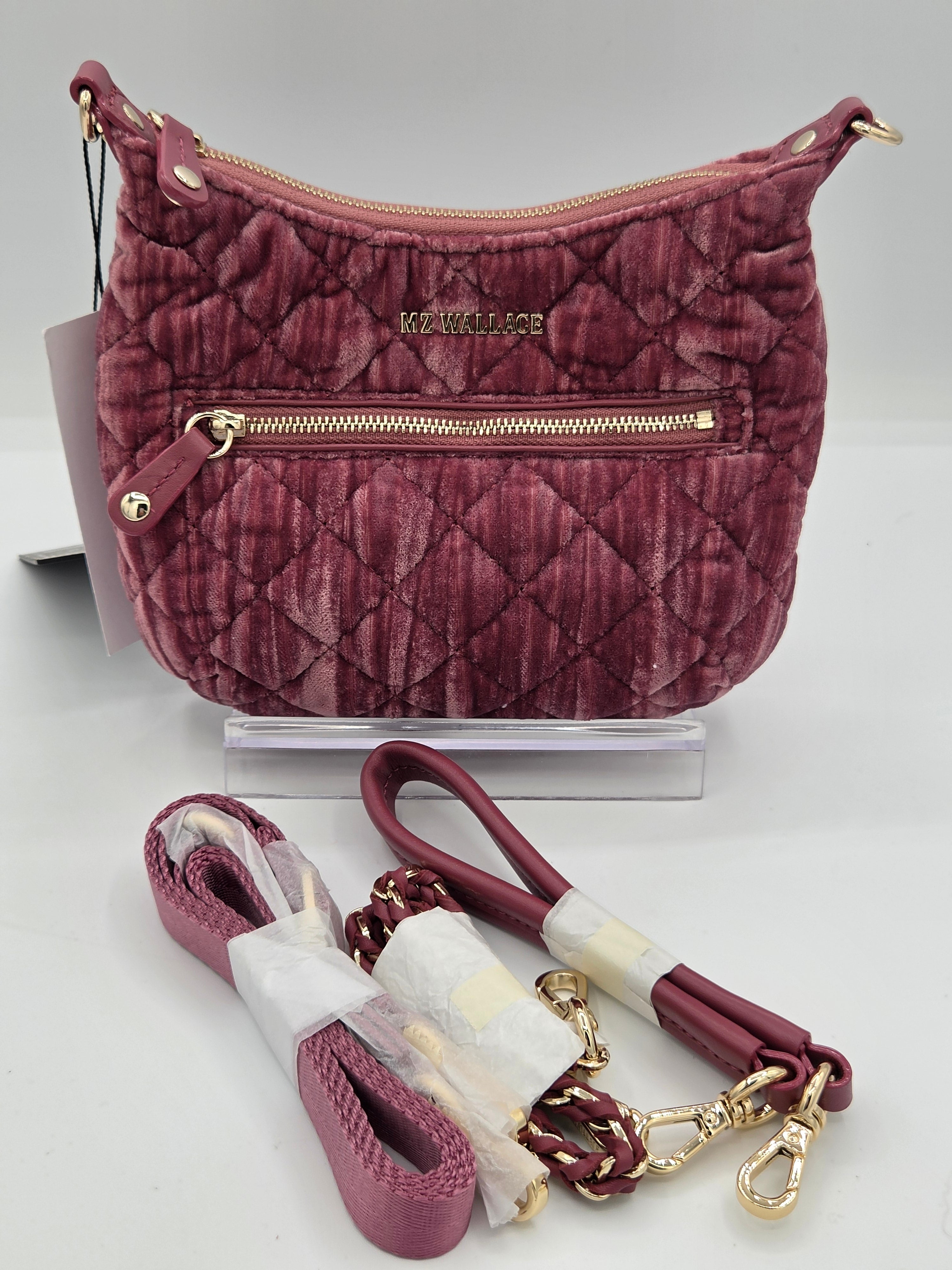 A burgundy quilted velvet shoulder bag with gold-tone hardware, displayed with its matching detachable woven strap on a white background.