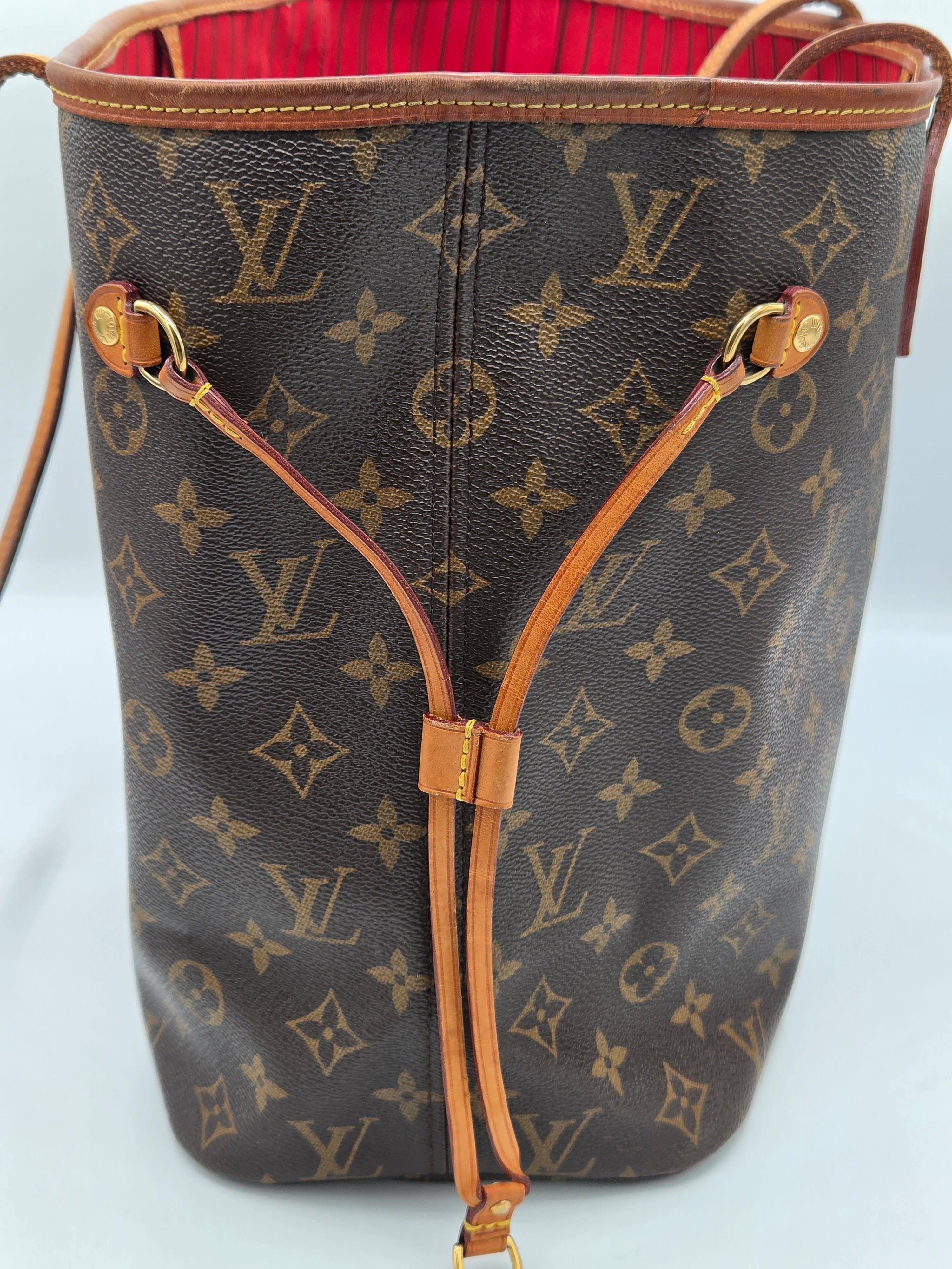 A Louis Vuitton Neverfull tote bag in brown monogram canvas with tan leather trim and drawstring straps, shown against a plain light background.