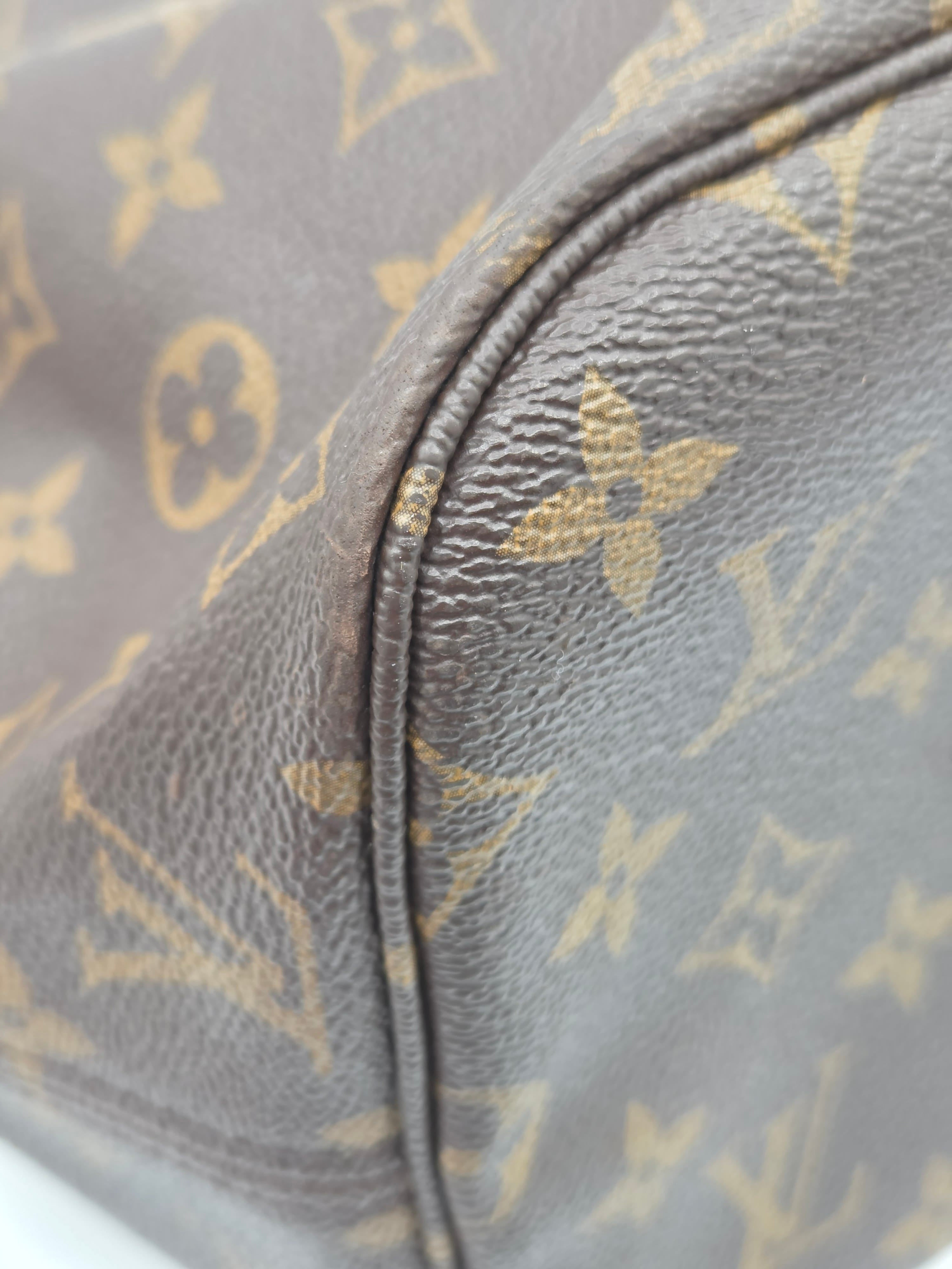 Close-up of a Louis Vuitton monogram canvas bag in brown and tan, showing the classic repeating floral and LV logo pattern and a curved seam.