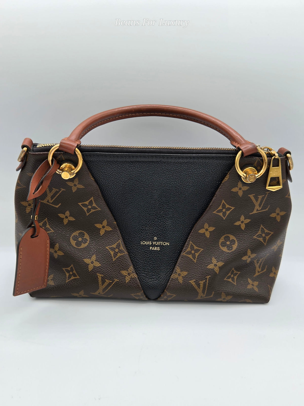 front of black and brown handbag