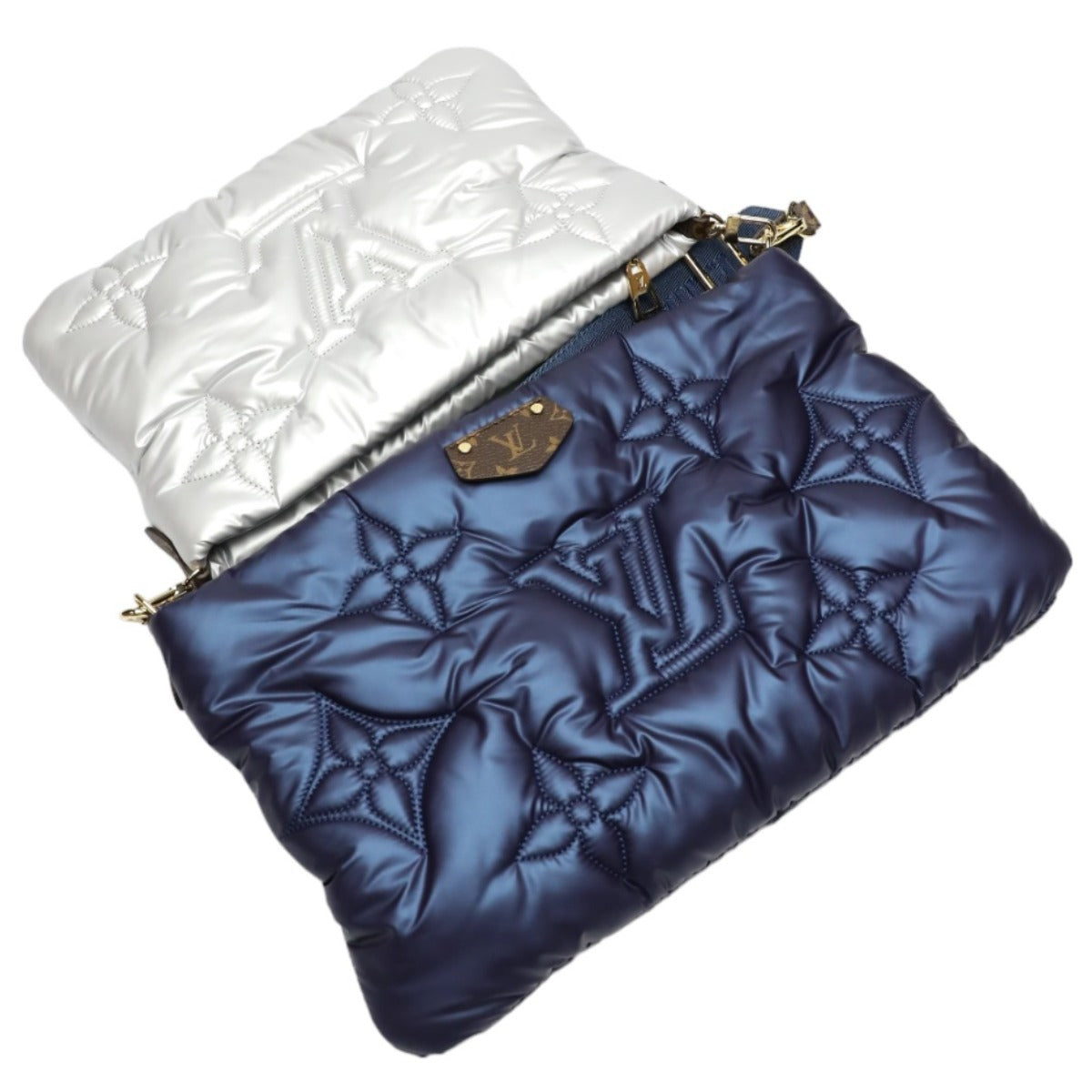 Two quilted handbags, one white and one blue, on a white background.