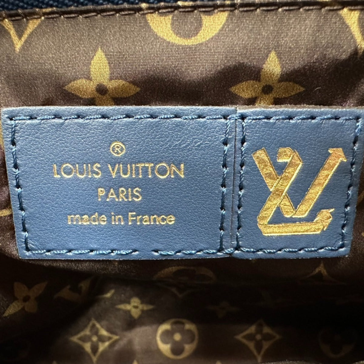 Louis Vuitton label on a patterned background