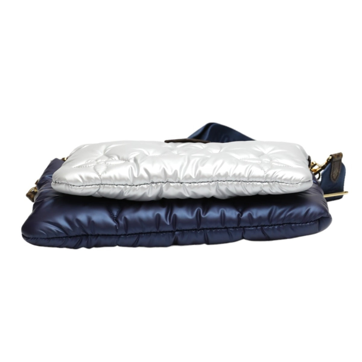 Navy and white quilted handbag on a white background