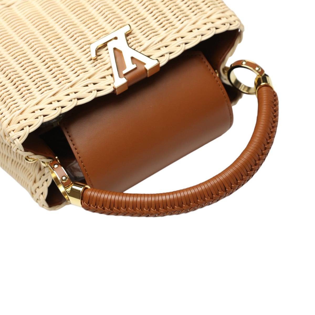 Woven handbag with brown interior and handle on a white background
