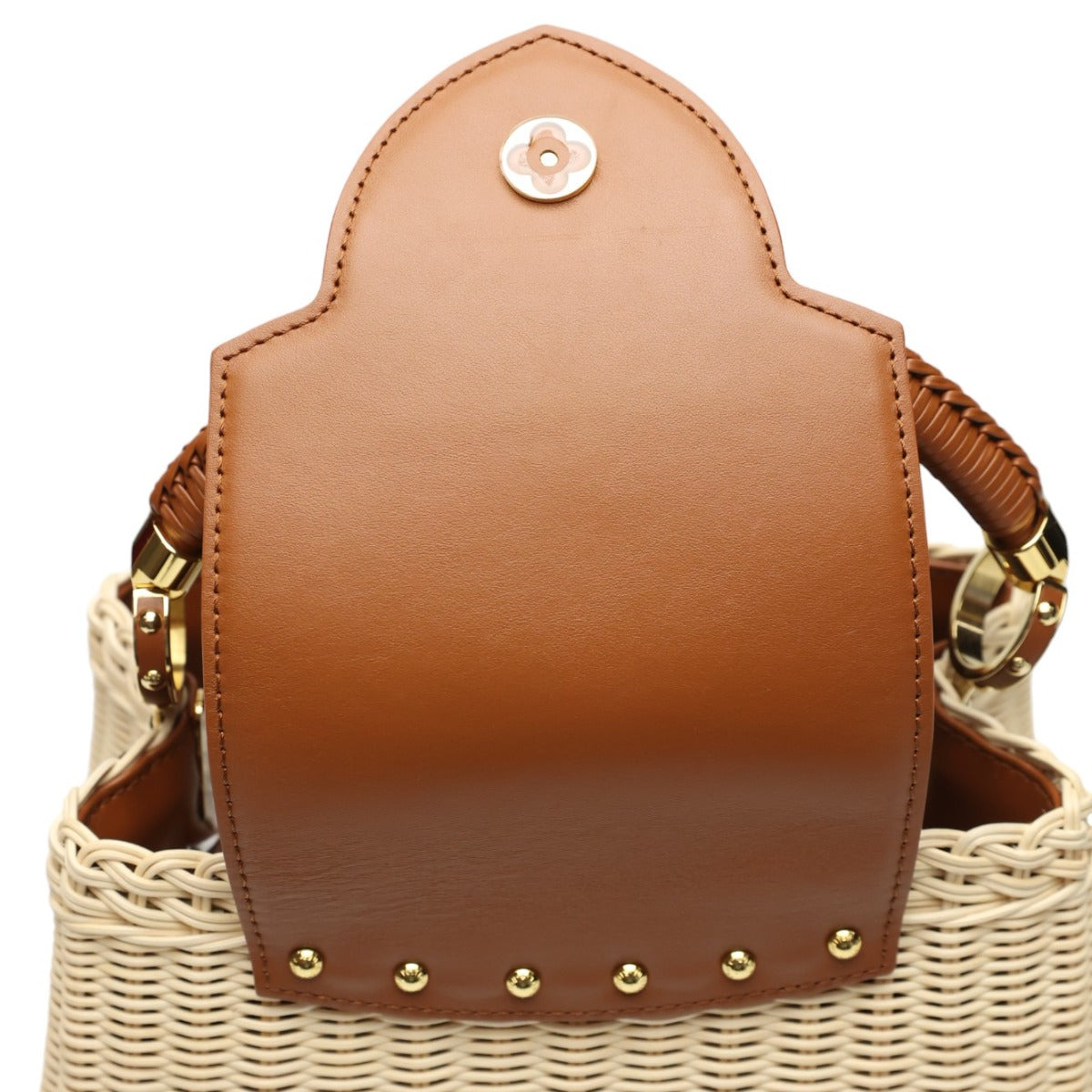 Brown leather bag with gold studs on a white background