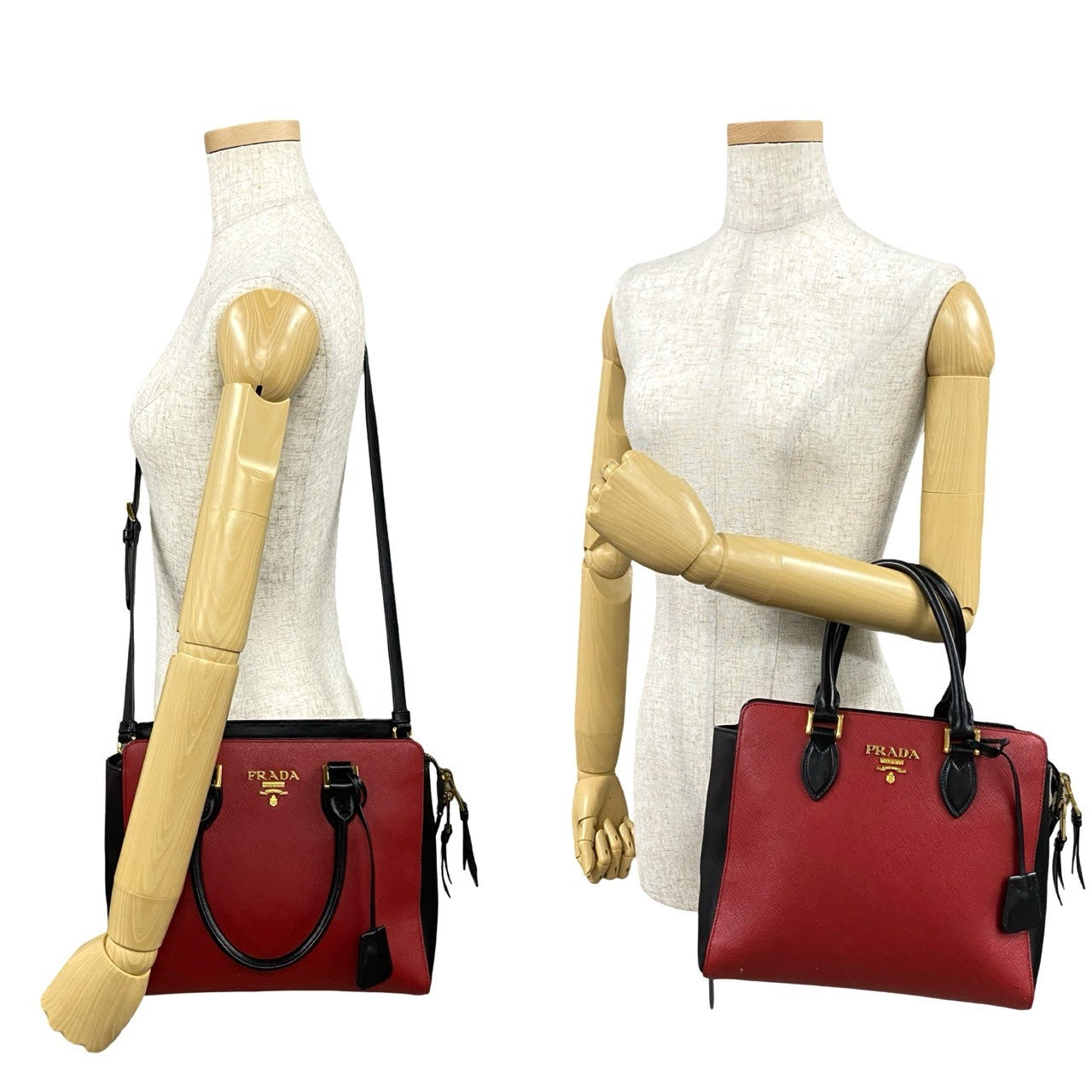 Two red Prada handbags on mannequin stands against a white background