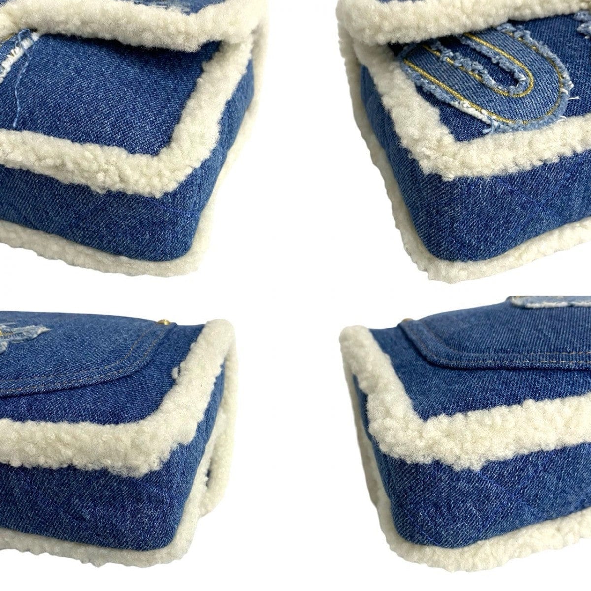 Four denim slippers with white lining on a white background