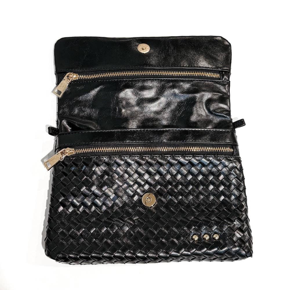 Black woven handbag with gold zipper and button details on a white background
