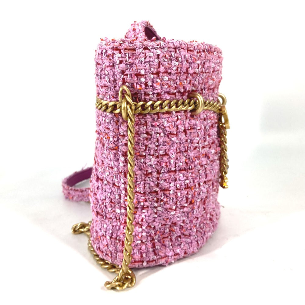 Pink glittery handbag with a gold chain strap on a white background
