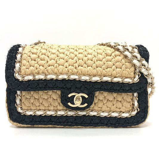 Woven handbag with black and beige design on a white background