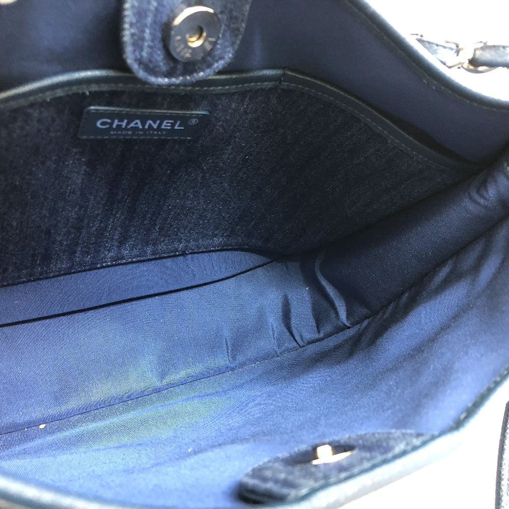 Close-up of a Chanel handbag with visible branding.