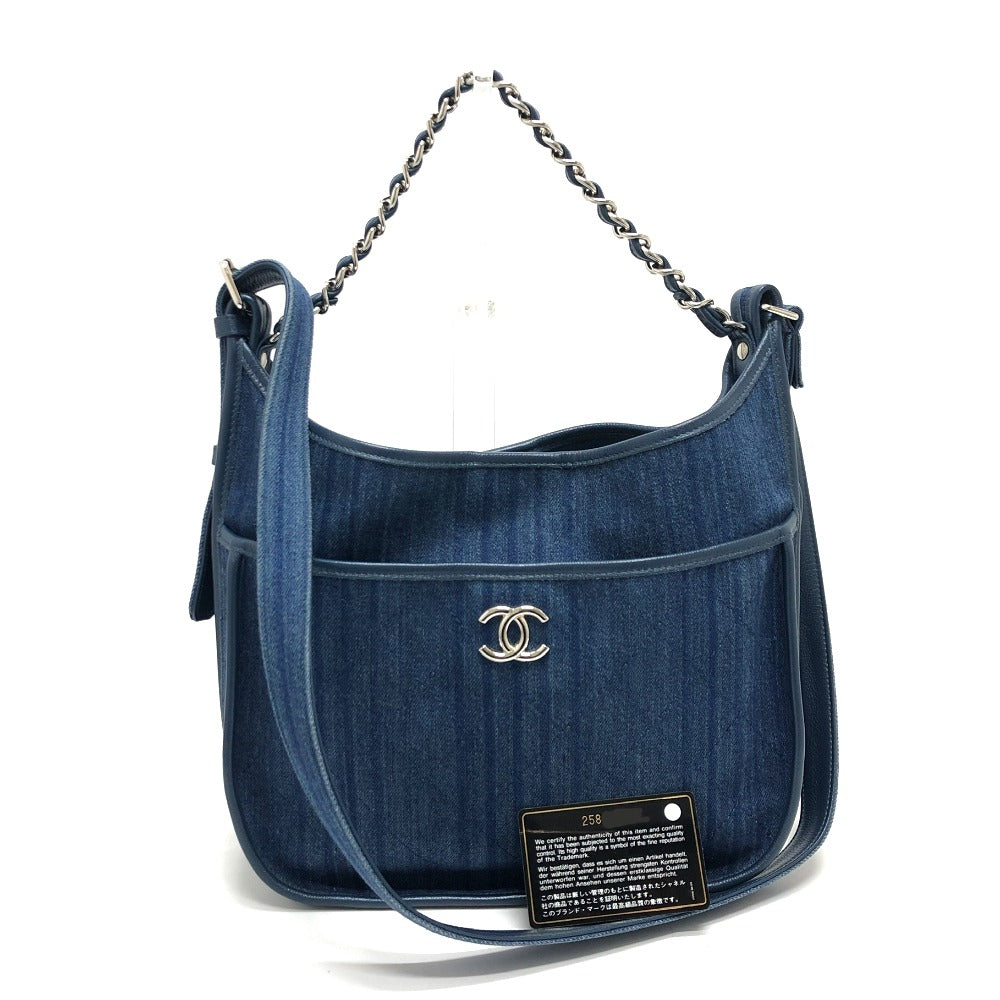Blue denim handbag with Chanel logo on a white background