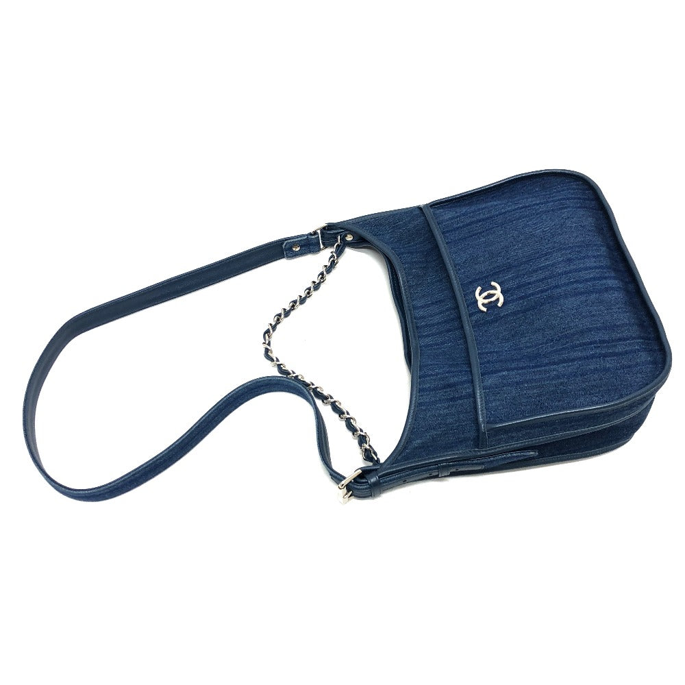 Blue handbag with a chain strap on a white background