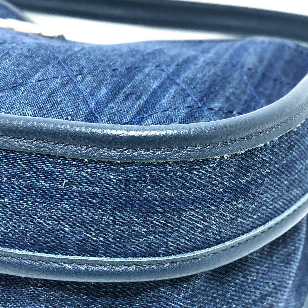 Close-up of blue denim fabric with a leather belt