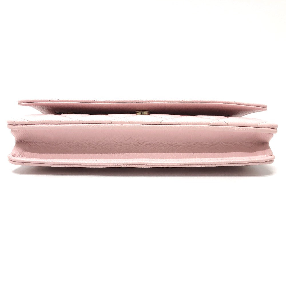 Pink handbag with textured surface on a white background