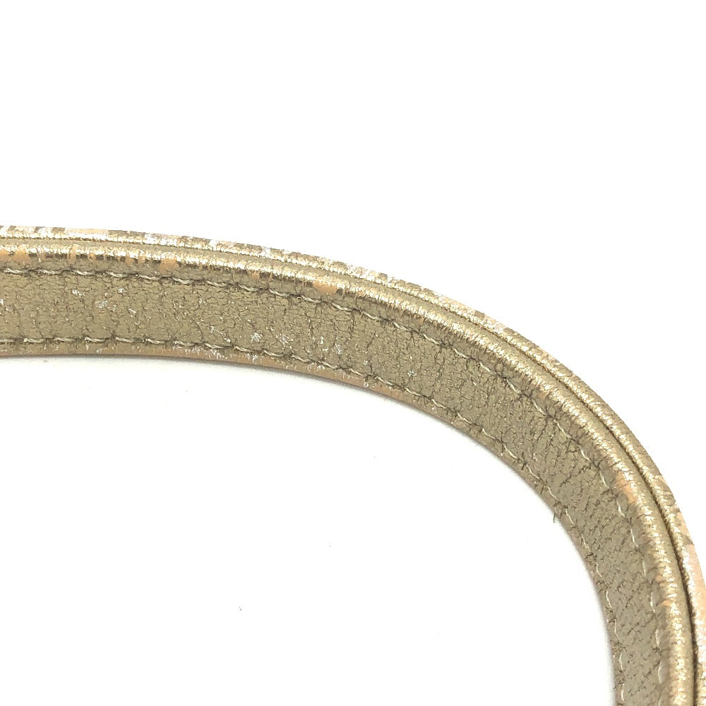 Close-up of a metallic ring on a white background