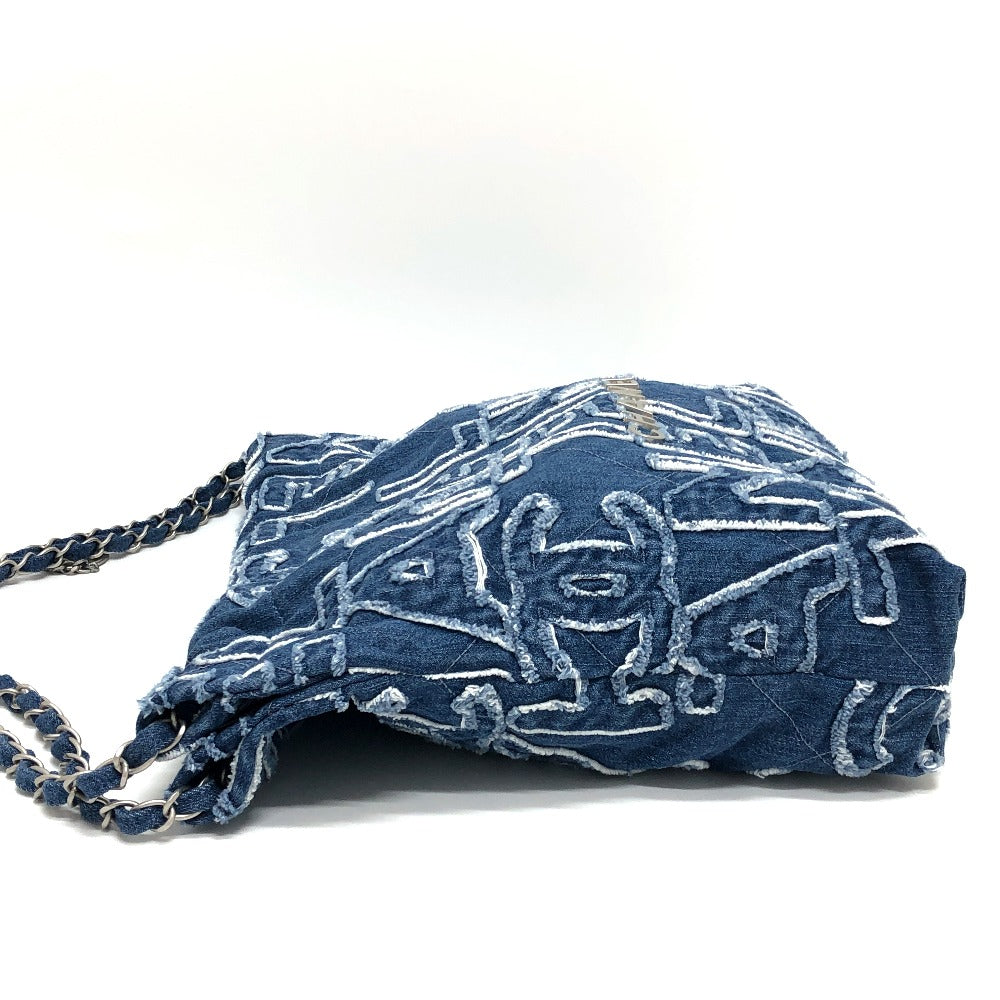 Blue patterned bag with a chain strap on a white background