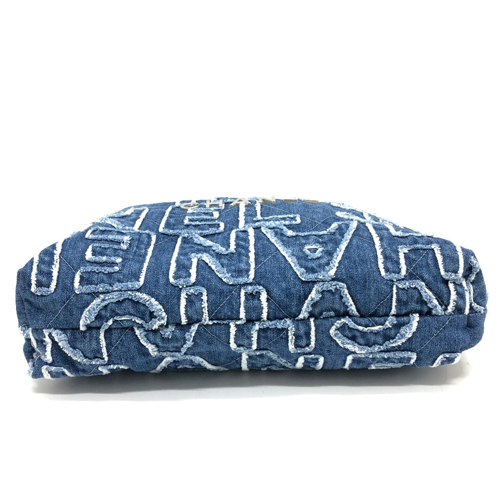 Folded denim fabric with white geometric patterns on a white background