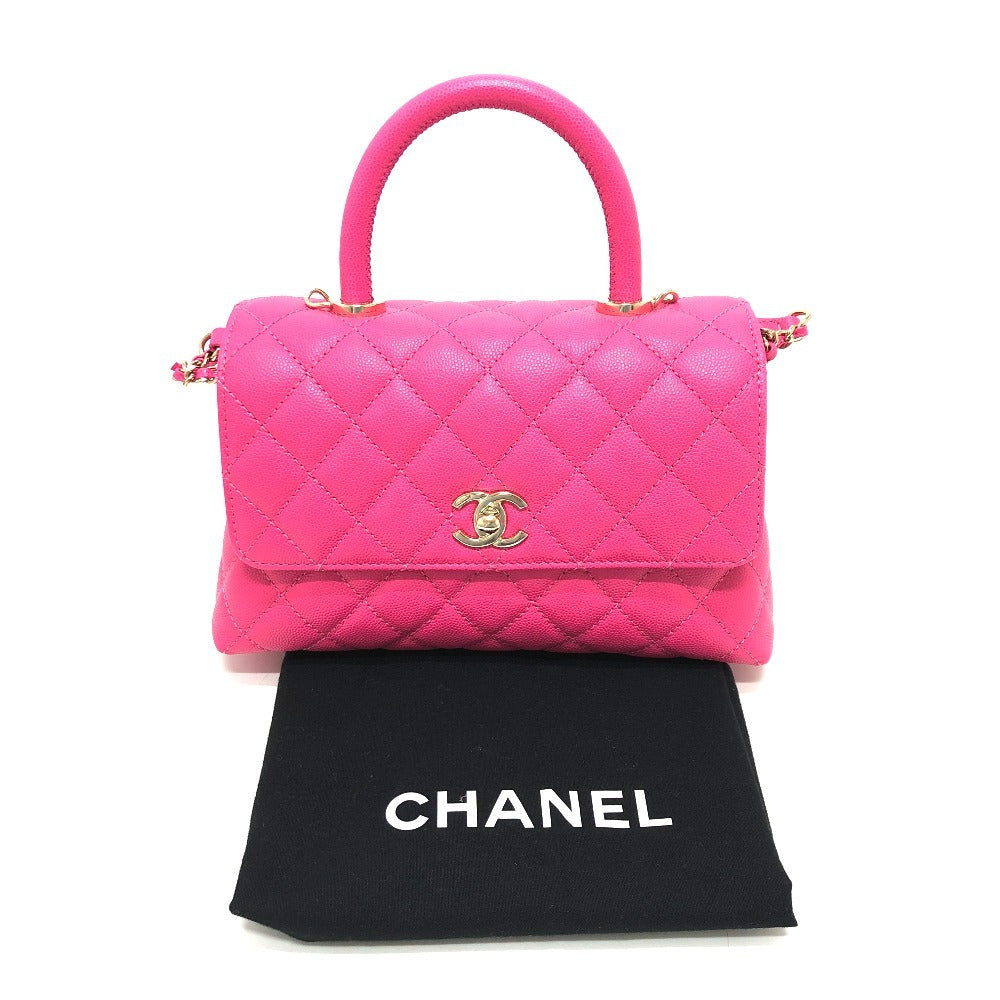 Pink quilted handbag with Chanel logo on a white background