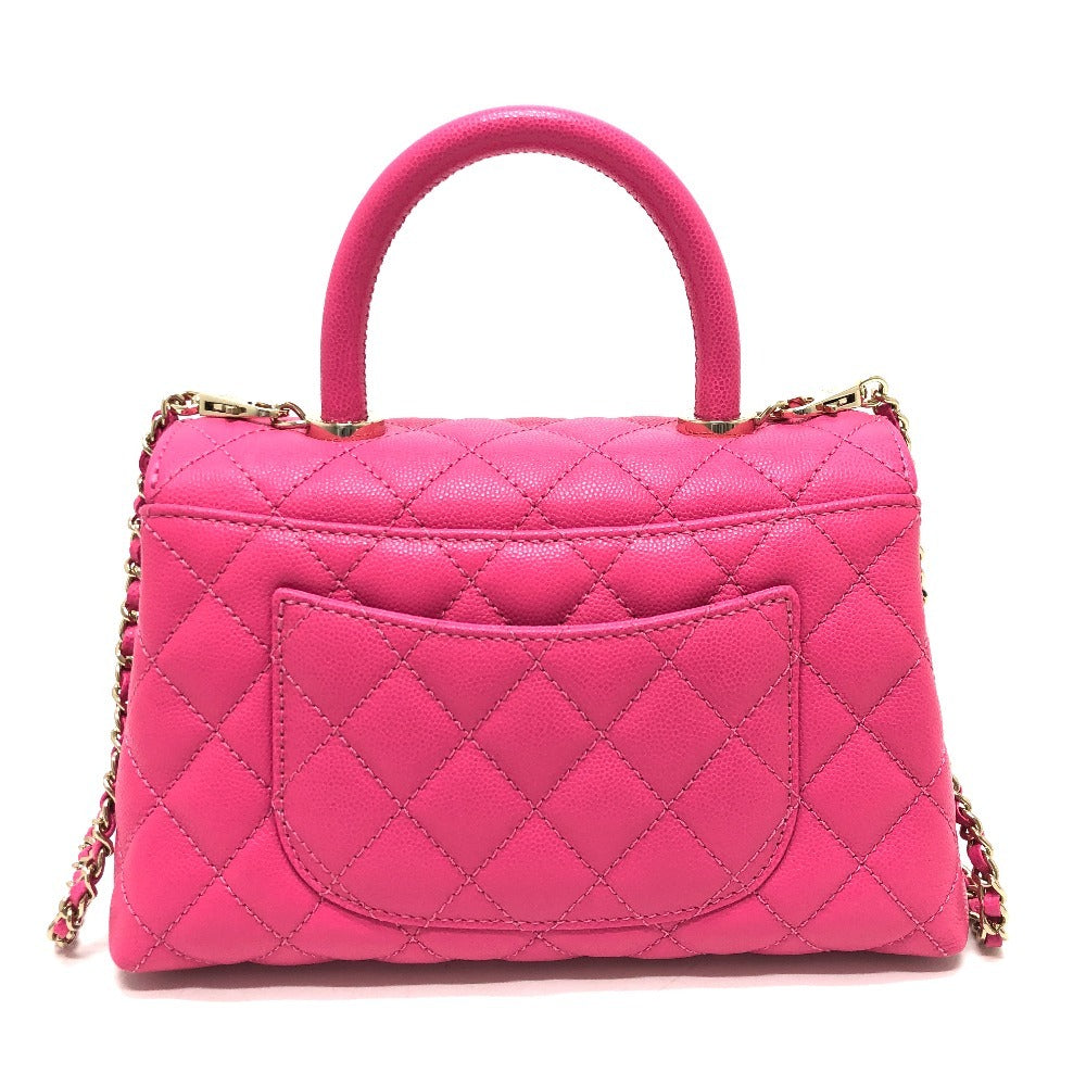 Pink quilted handbag with a chain detail on a white background