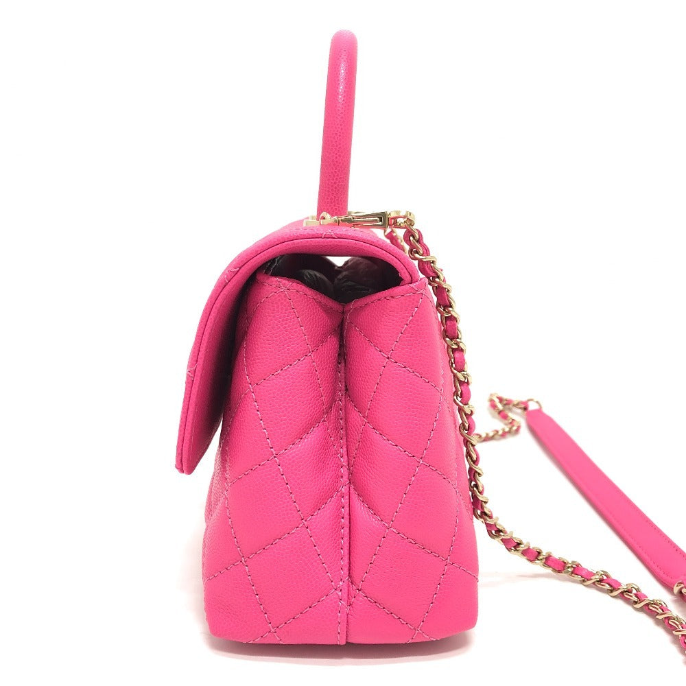 Pink quilted handbag with a chain strap on a white background