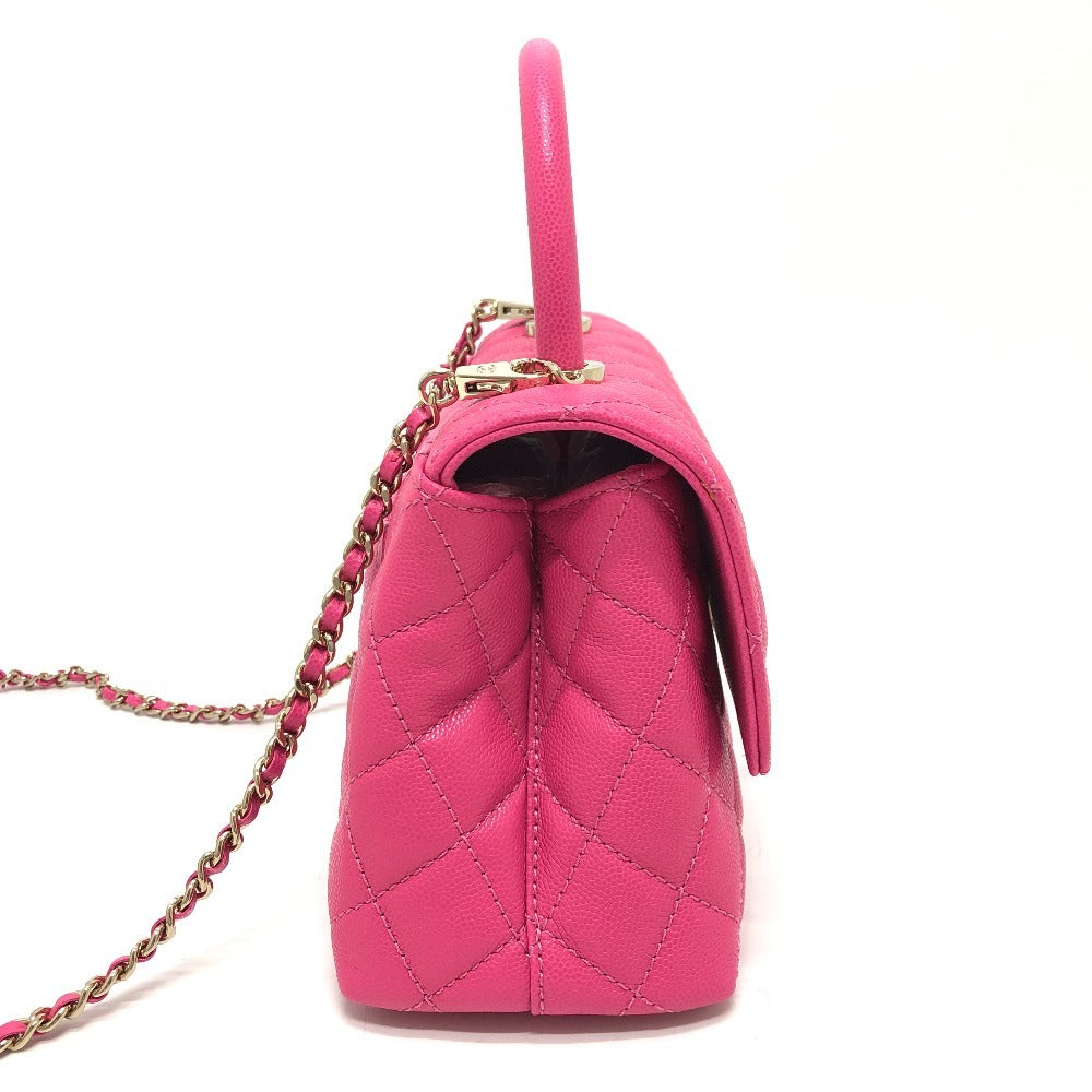 Pink quilted handbag with a chain strap on a white background