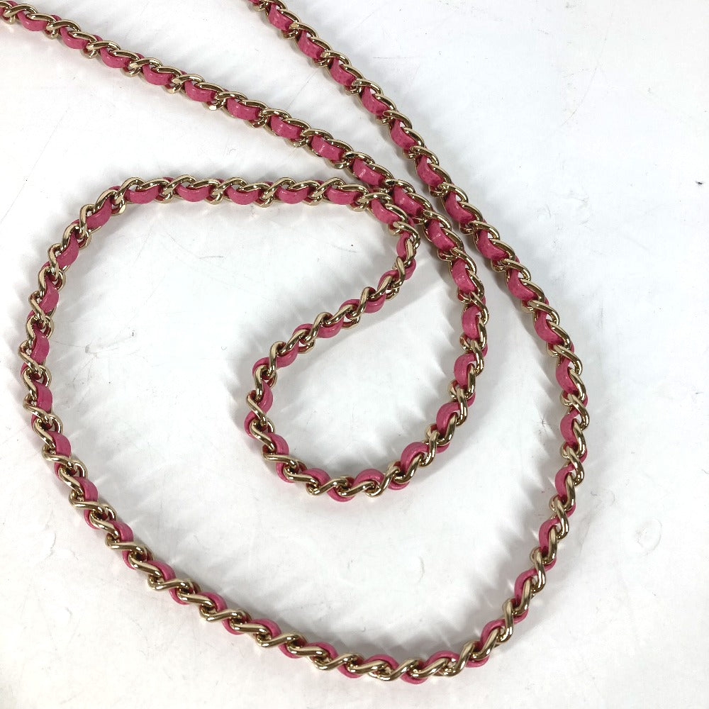 Pink and gold chain on a white background