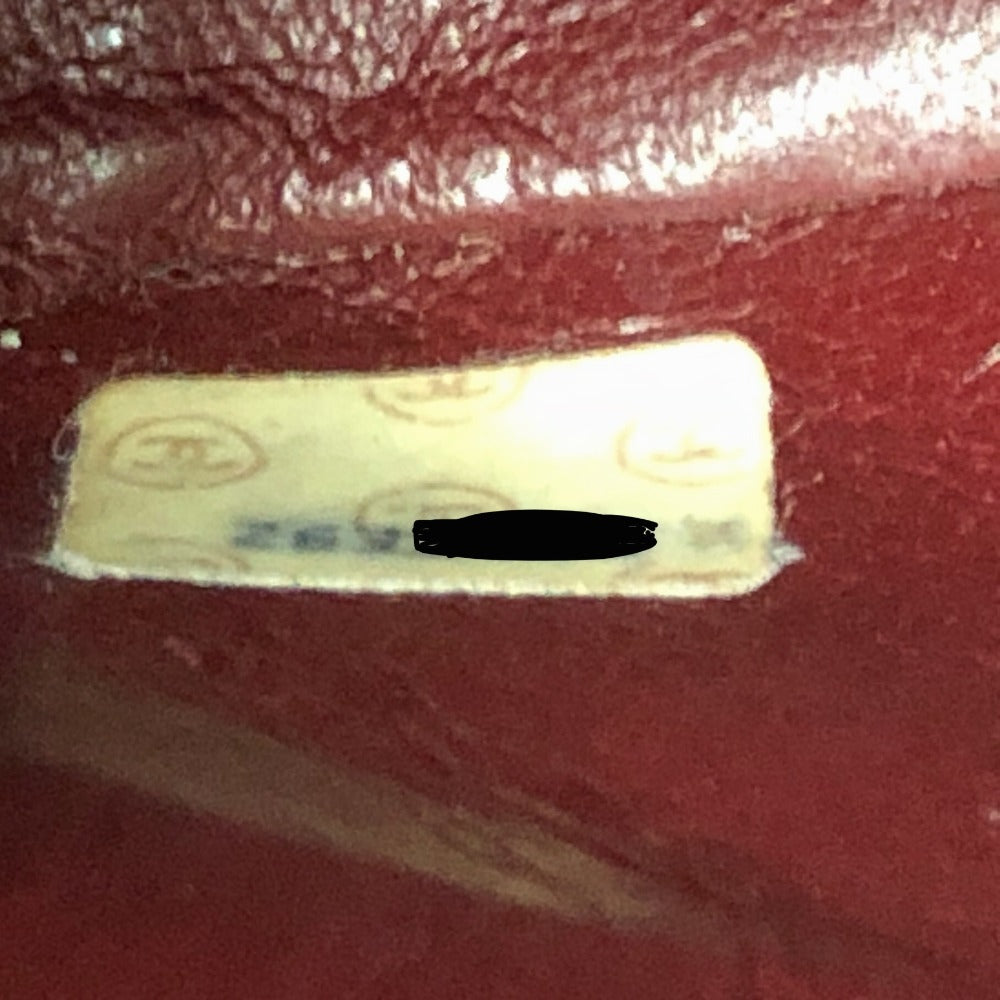 Small rectangular label on a red textured surface