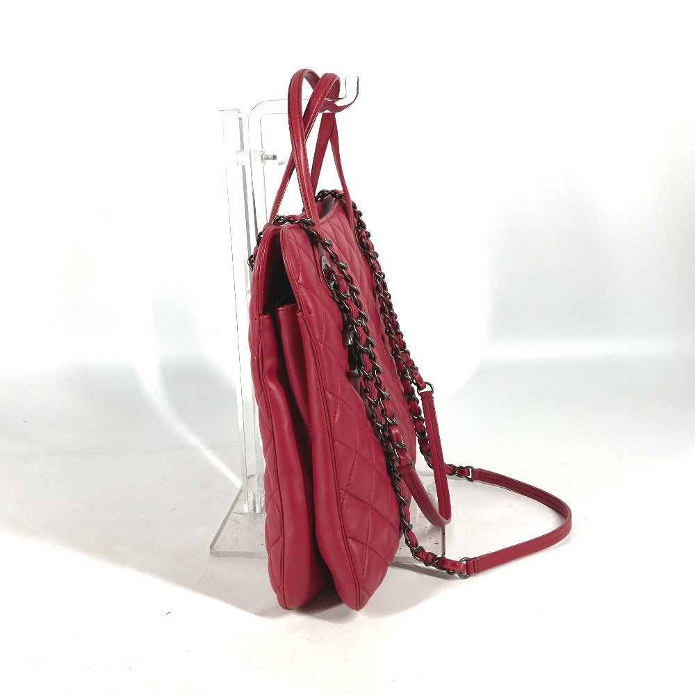 Red handbag with a chain strap on a white background