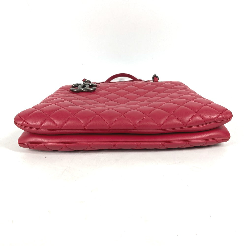 Pink quilted handbag on a white background