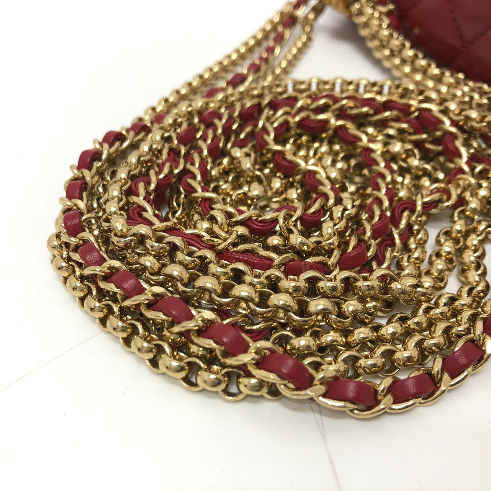 Gold chain with red accents on a white background
