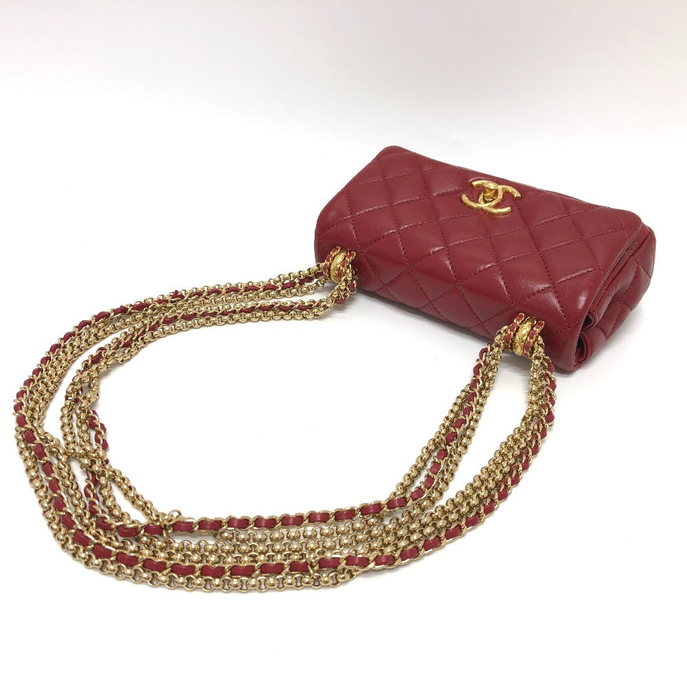 Red handbag with gold chain on a white background