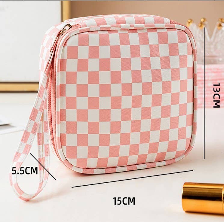 Pink and white checkered pouch with measurements on a light background