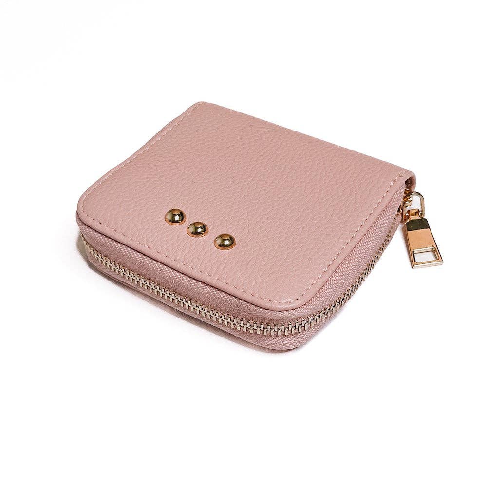 Pink wallet with gold accents on a white background